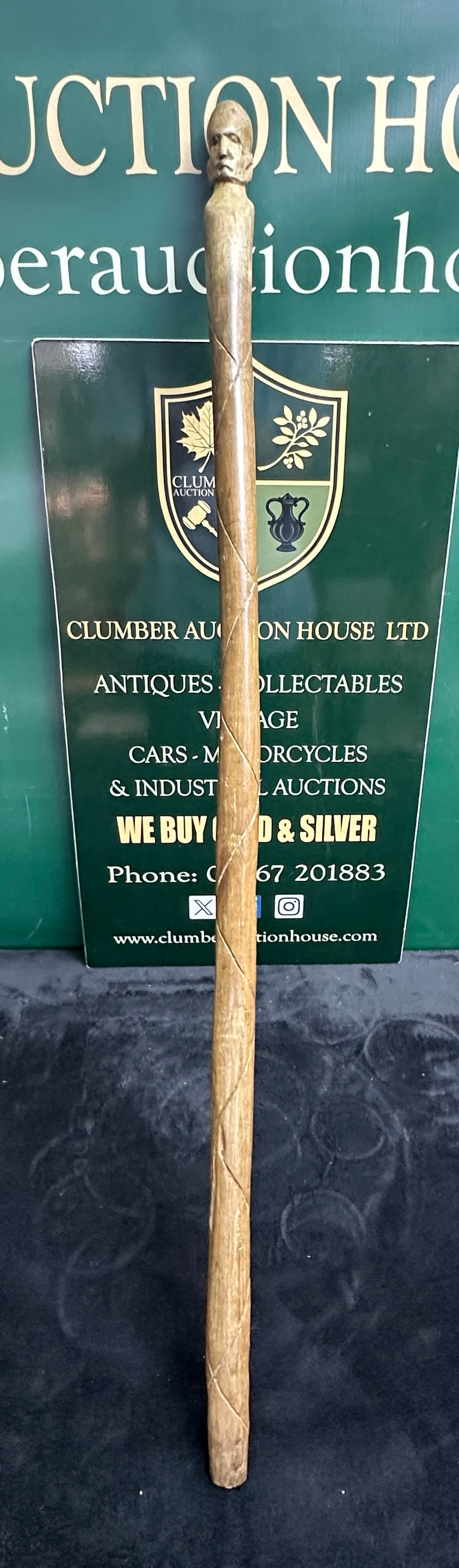 A Hand-Carved Wood Walking Stick, with a Human Head Pommel