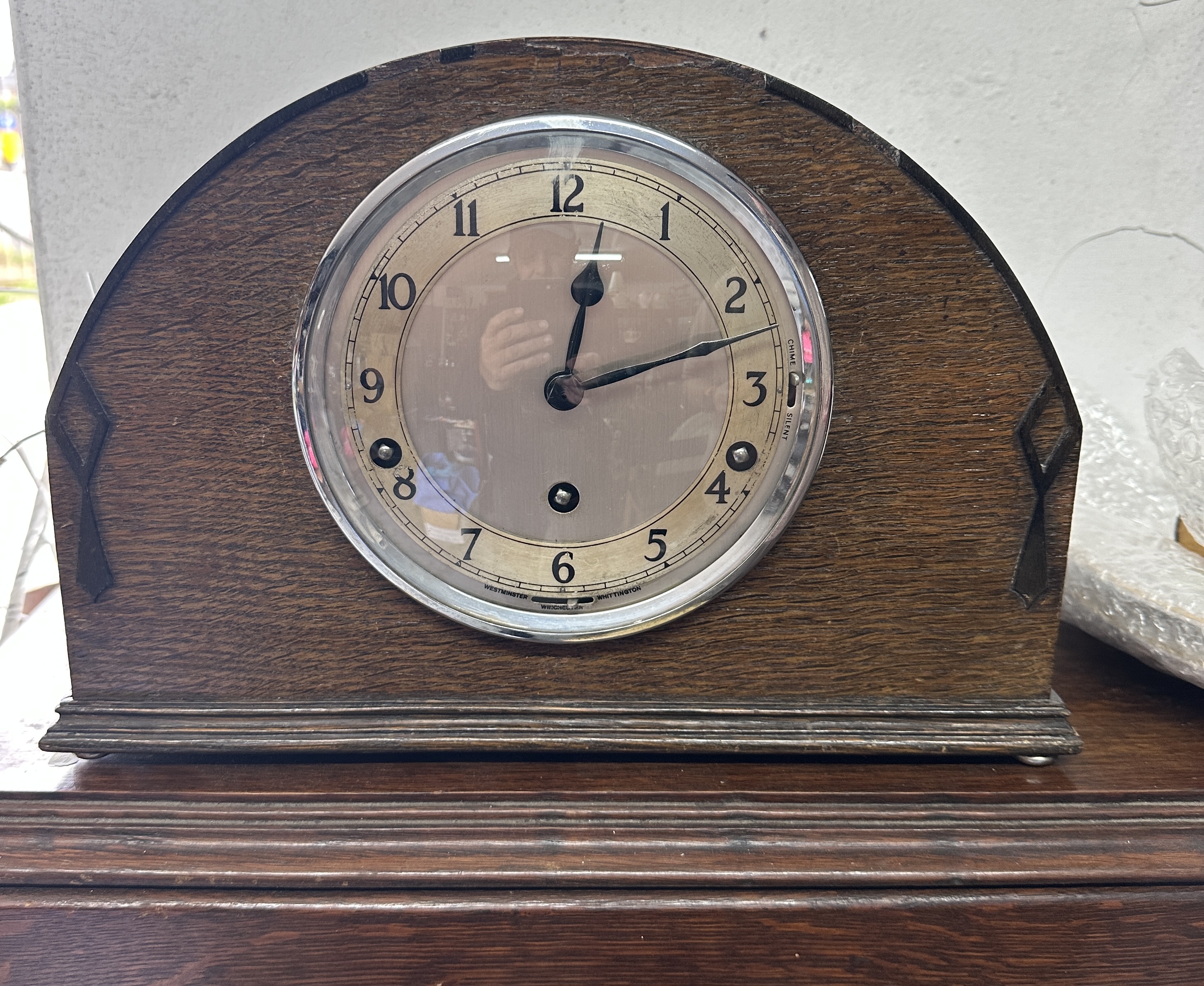 A Garrard Clocks Ltd. English Wood-Veneered Mantel Clock with Key
