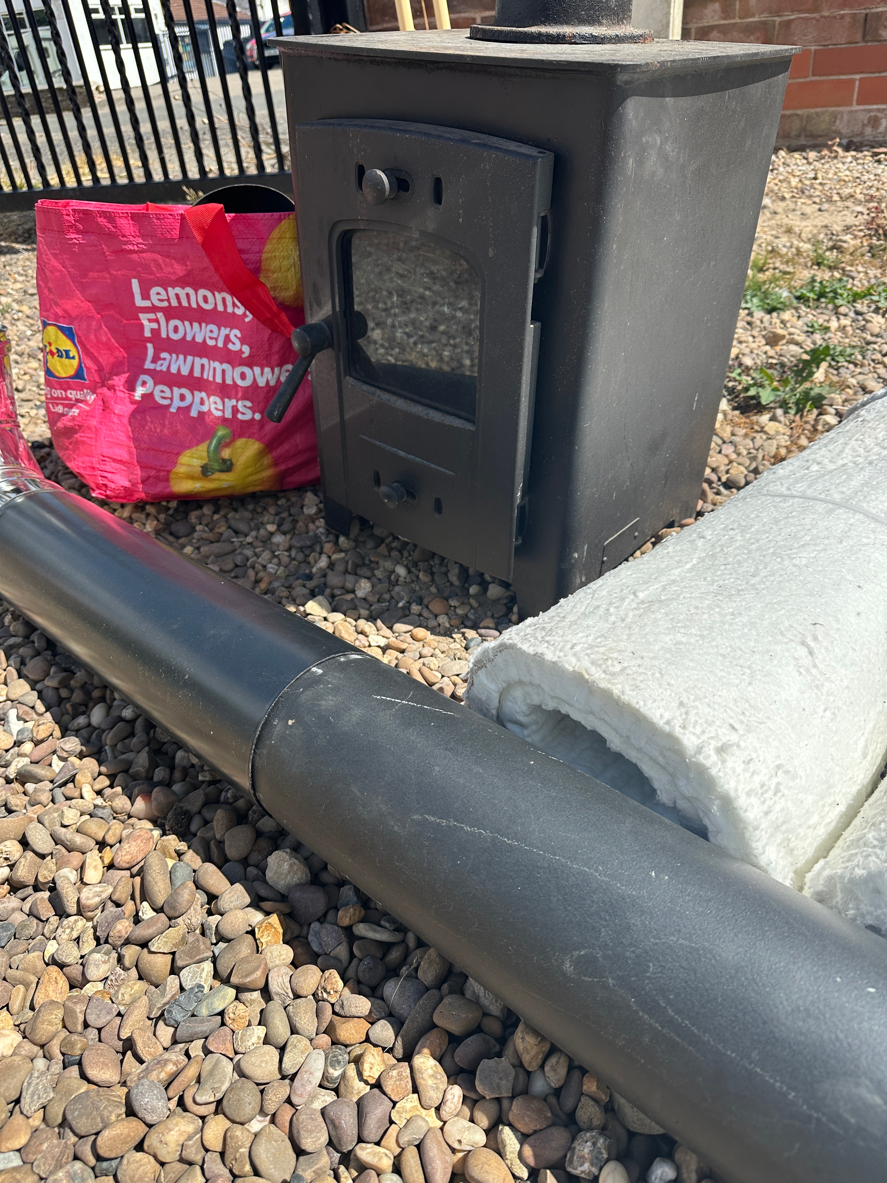 A Metal Multi-Fuel Stove with Flue Sections and Insulation Materials