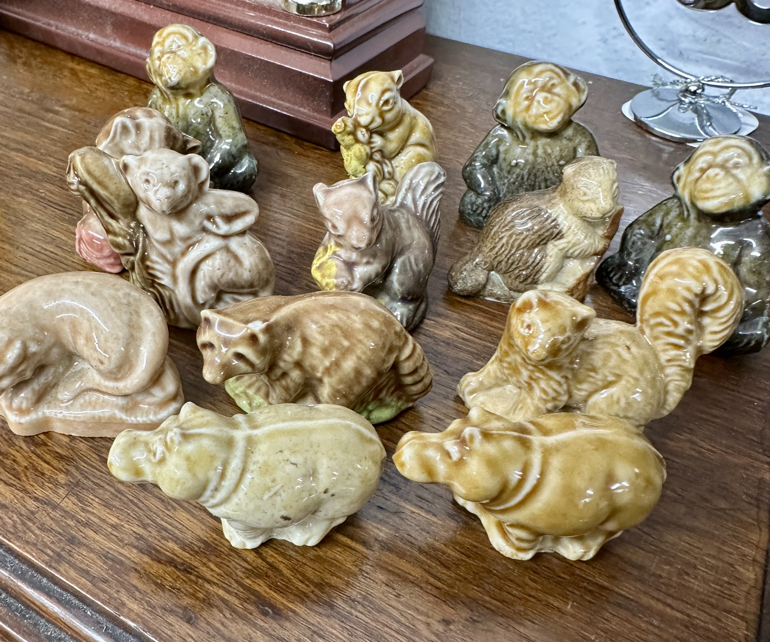 An Assortment of Eleven Glazed Animal Figurines featuring Mottled Earth Tones