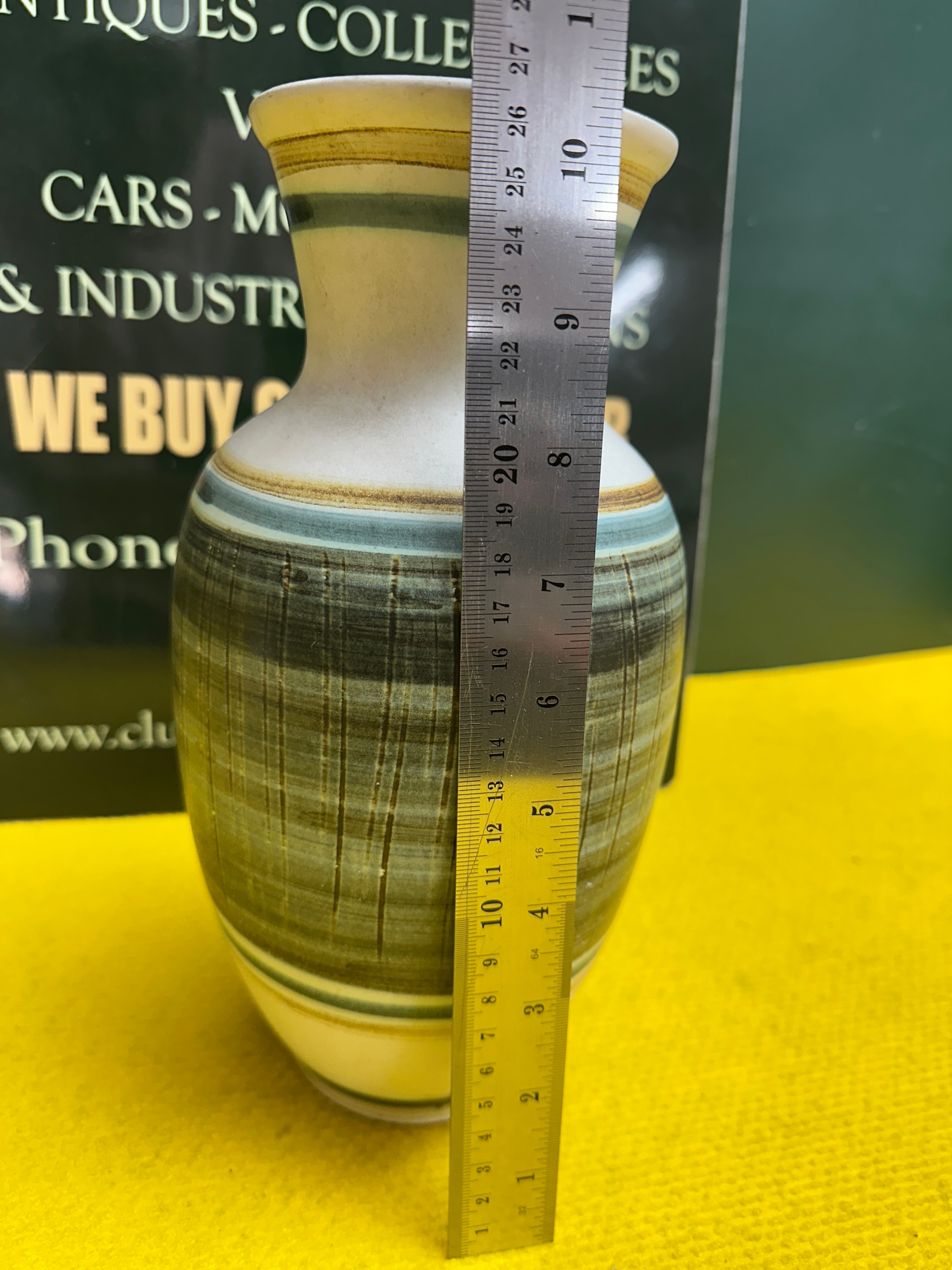 A Ceramic Vase with Sgraffito Banded Decoration