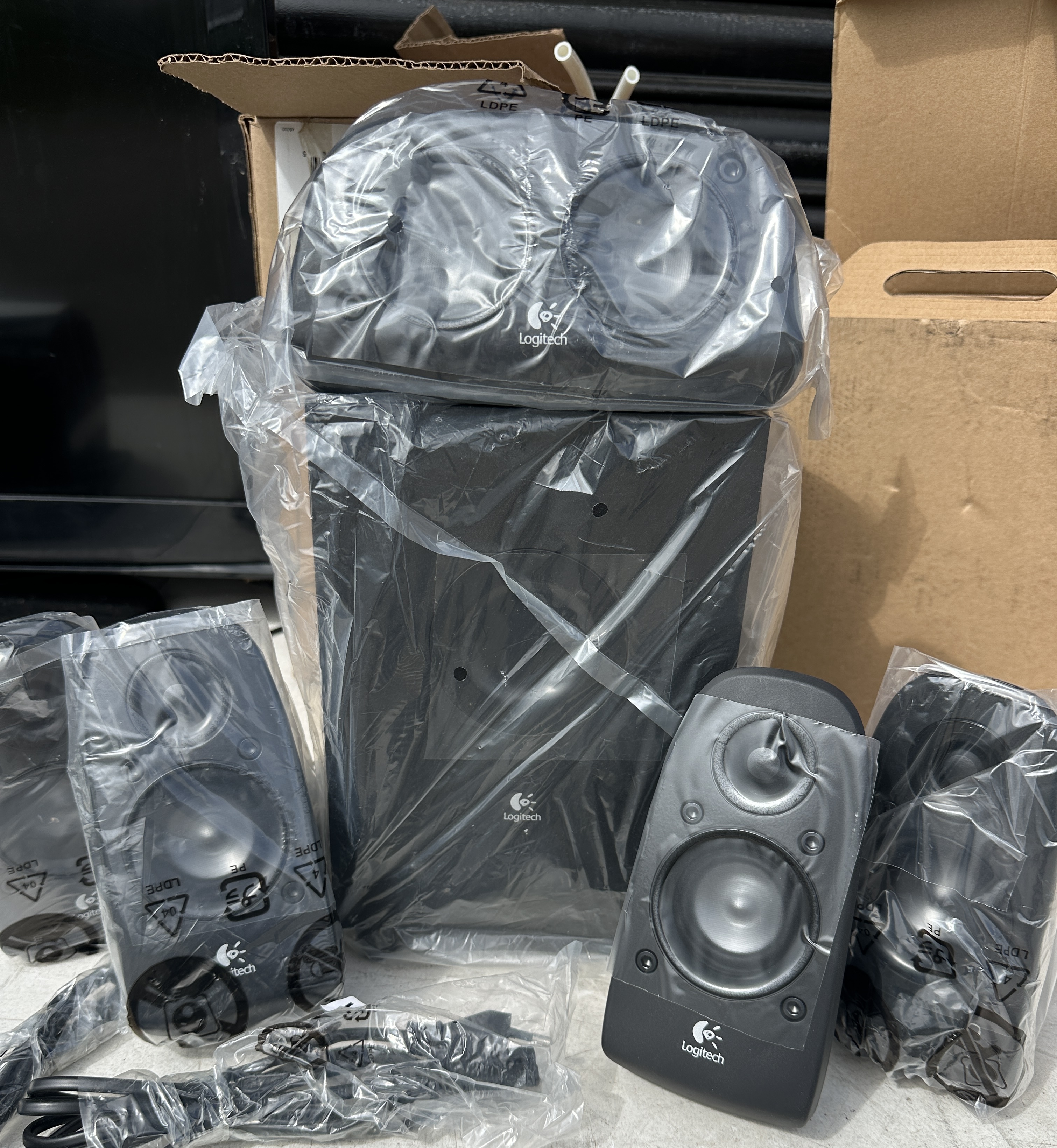 A Logitech 5.1 Surround Sound Speaker System, with associated cables