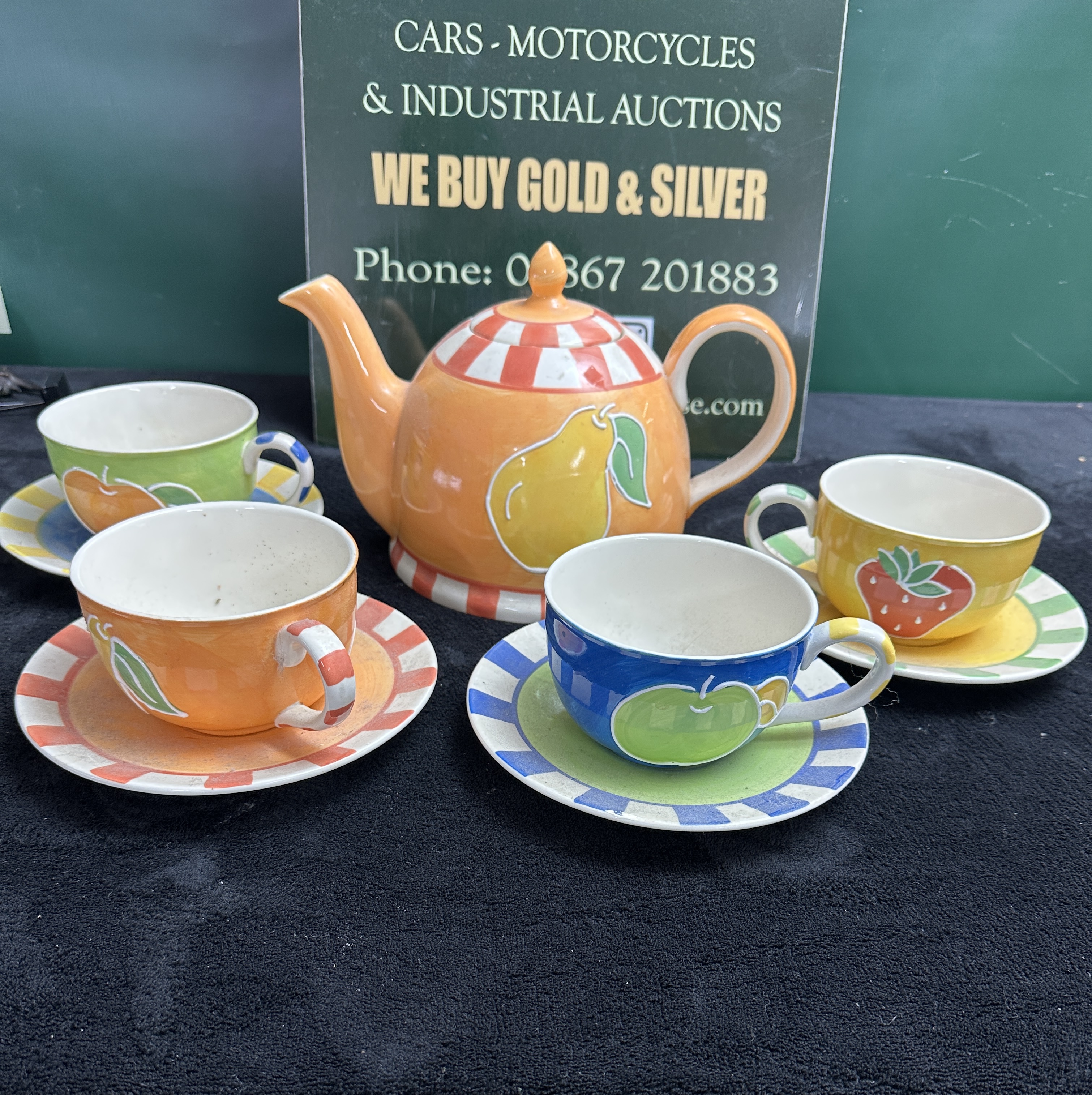 A Nine-Piece Glazed Earthenware Tea Set, fruit motif
