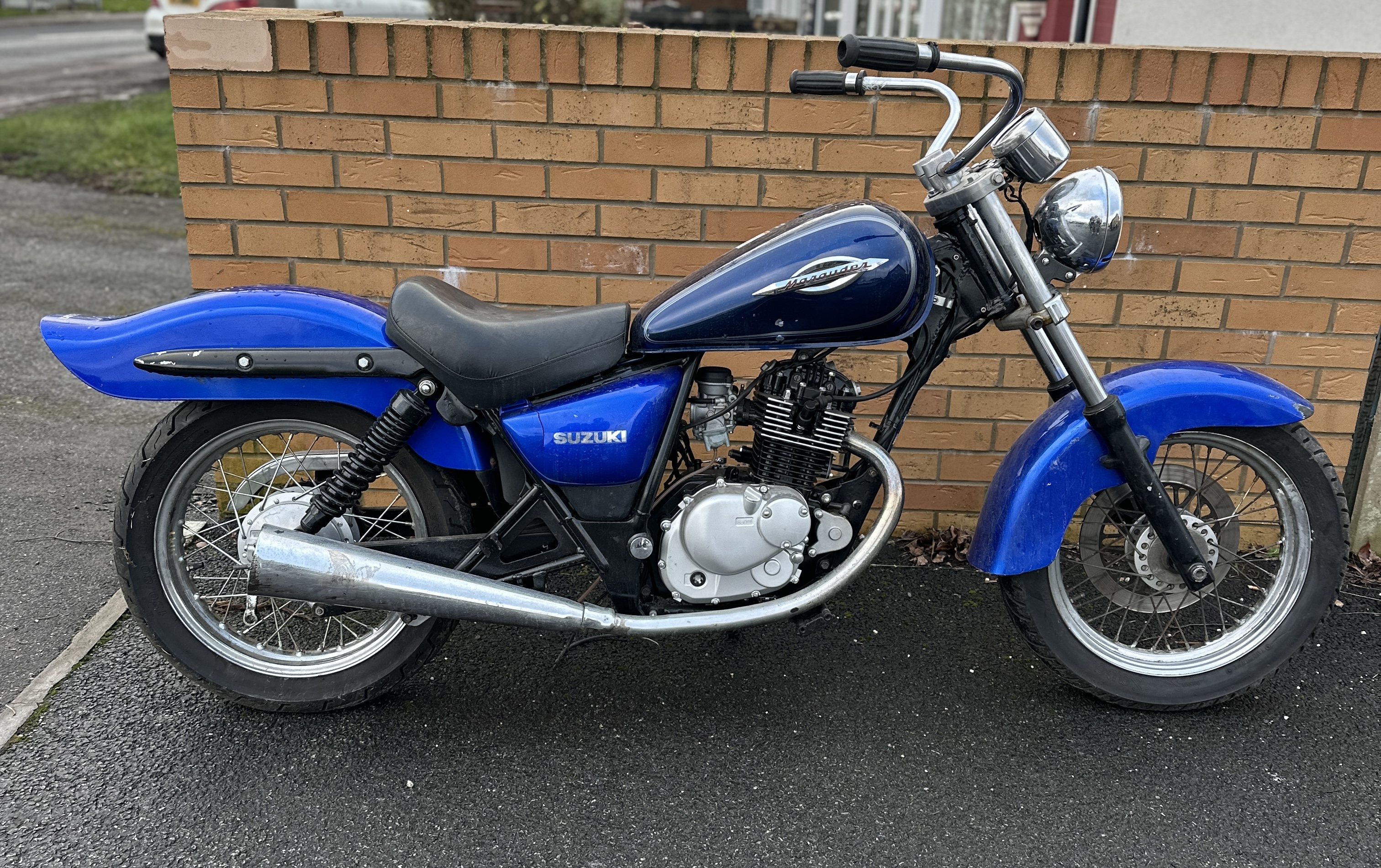 A Suzuki Marauder Motorcycle with Blue Finish and Spoked Wheels
