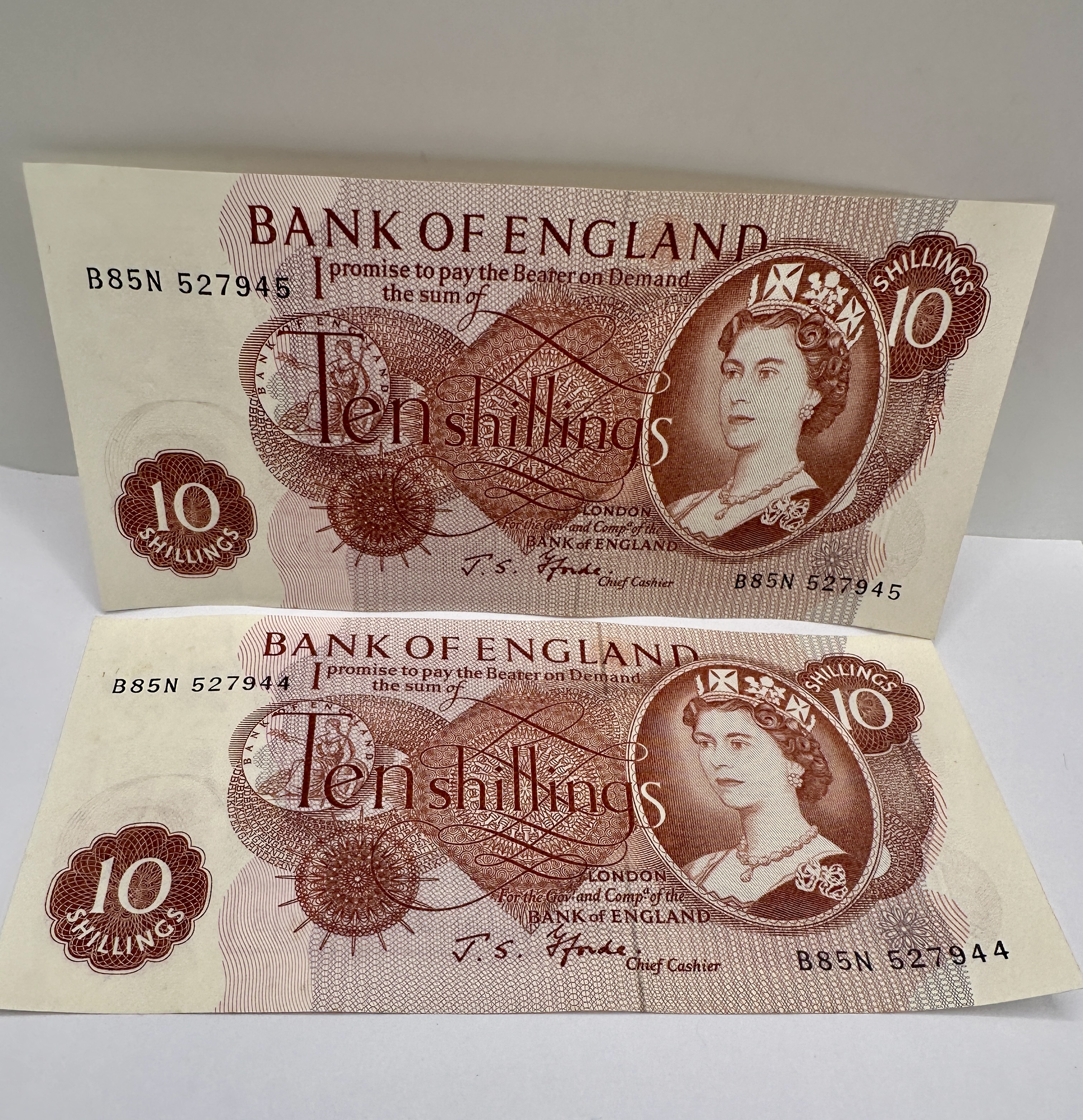 A Mid-20th Century Pair of Consecutive Bank of England Ten Shilling Banknotes