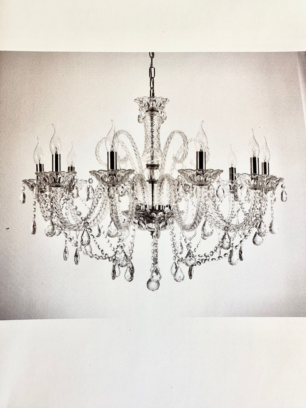 A Glass and Metal Twelve-Light Chandelier with Original Packaging