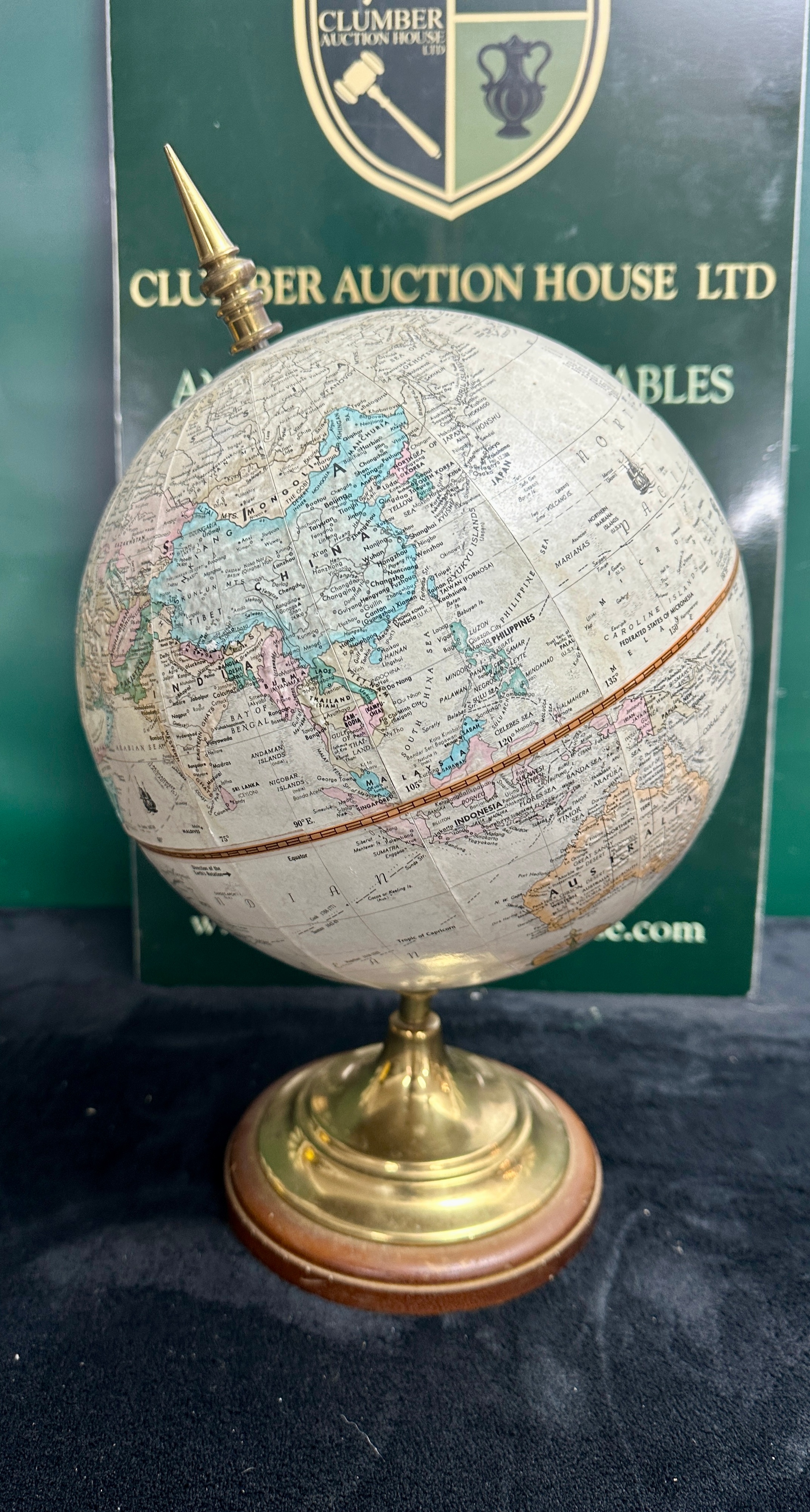 A Terrestrial Desk Globe on a Metal and Wood Stand