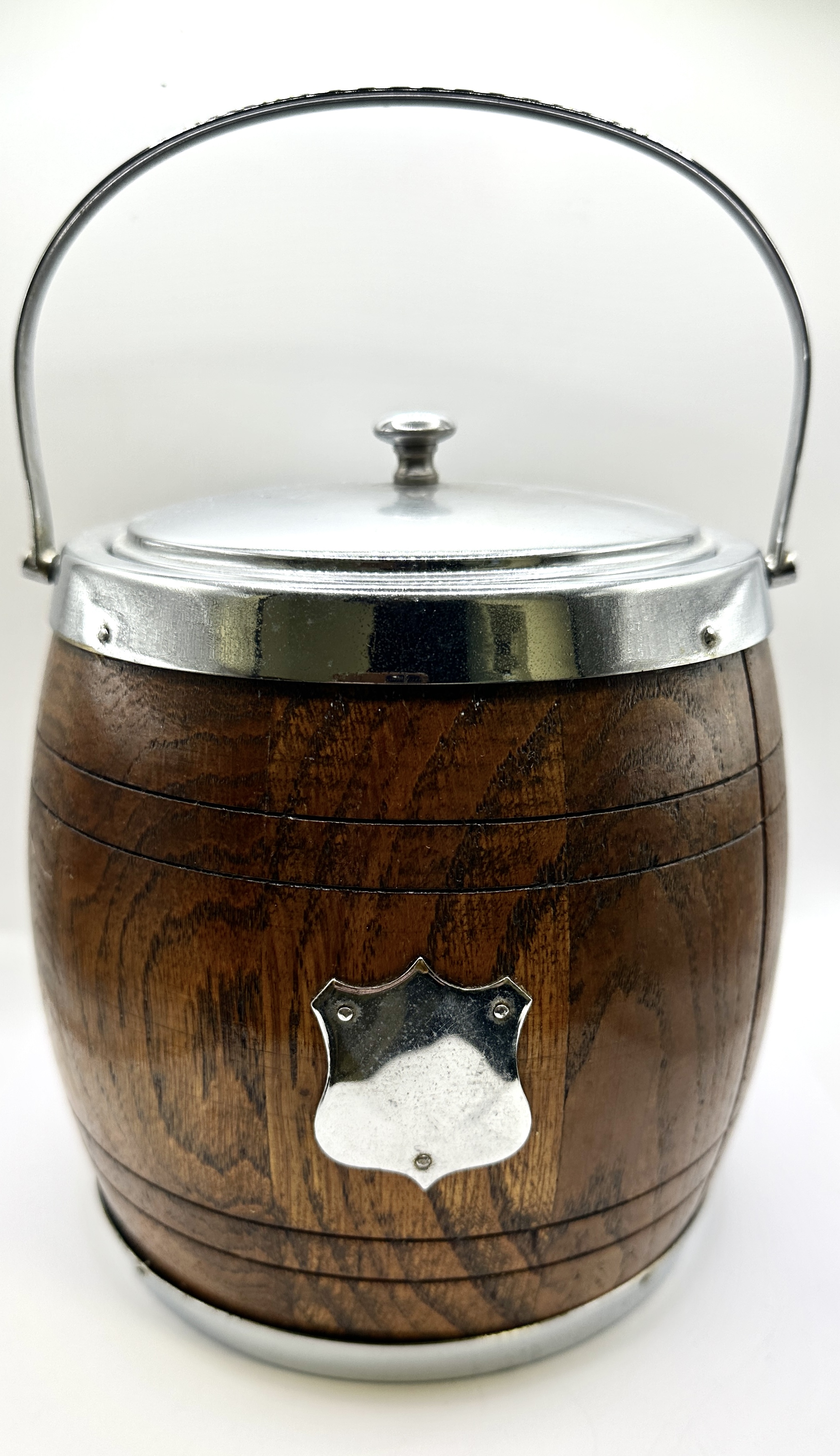 A Wooden Biscuit Barrel with Metal Mounts and Ceramic Liner