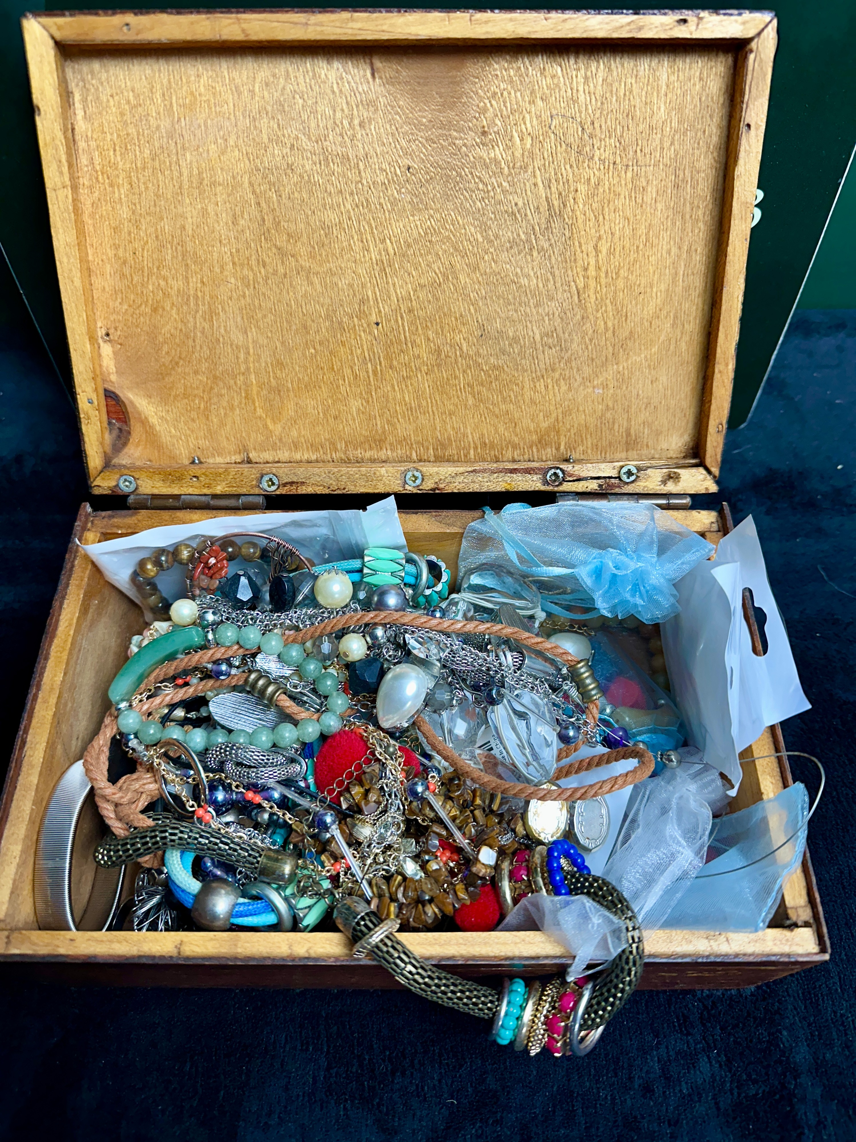 An Assortment of Costume Jewellery in a Wooden Storage Box