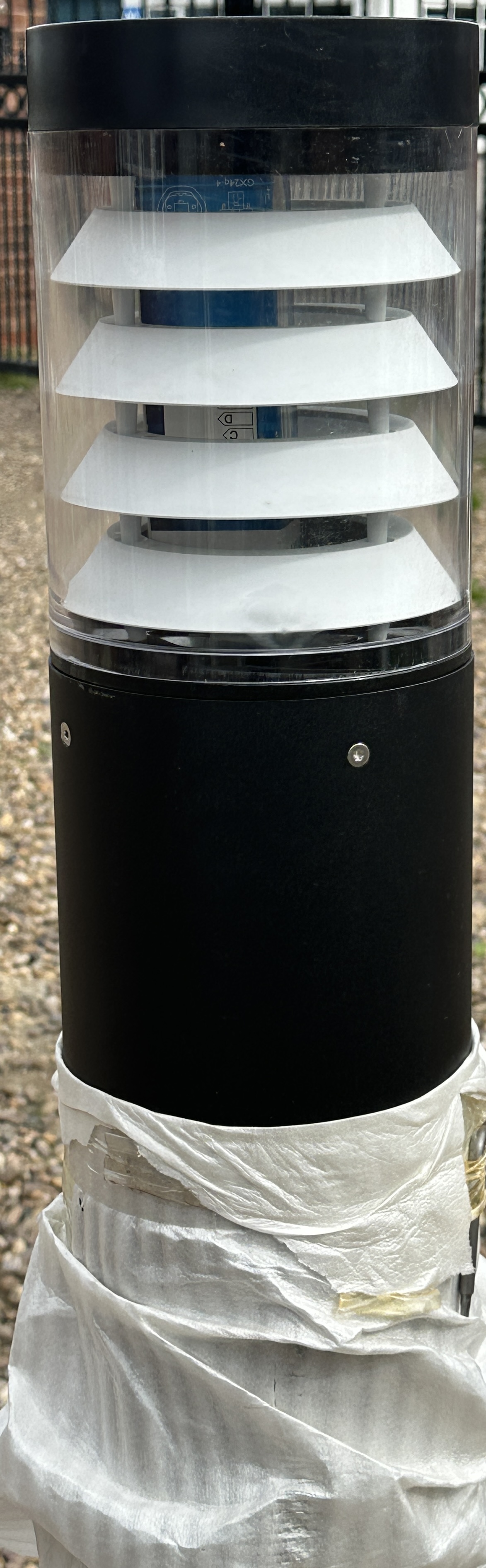 A Contemporary Outdoor Bollard Light with Internal Louvers and Packaging