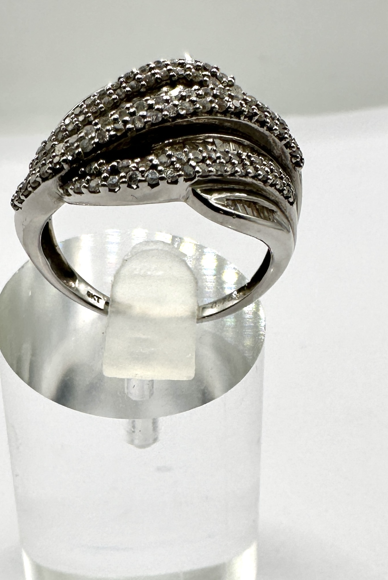A 9ct White Gold Crossover Cocktail Ring Set with Stones