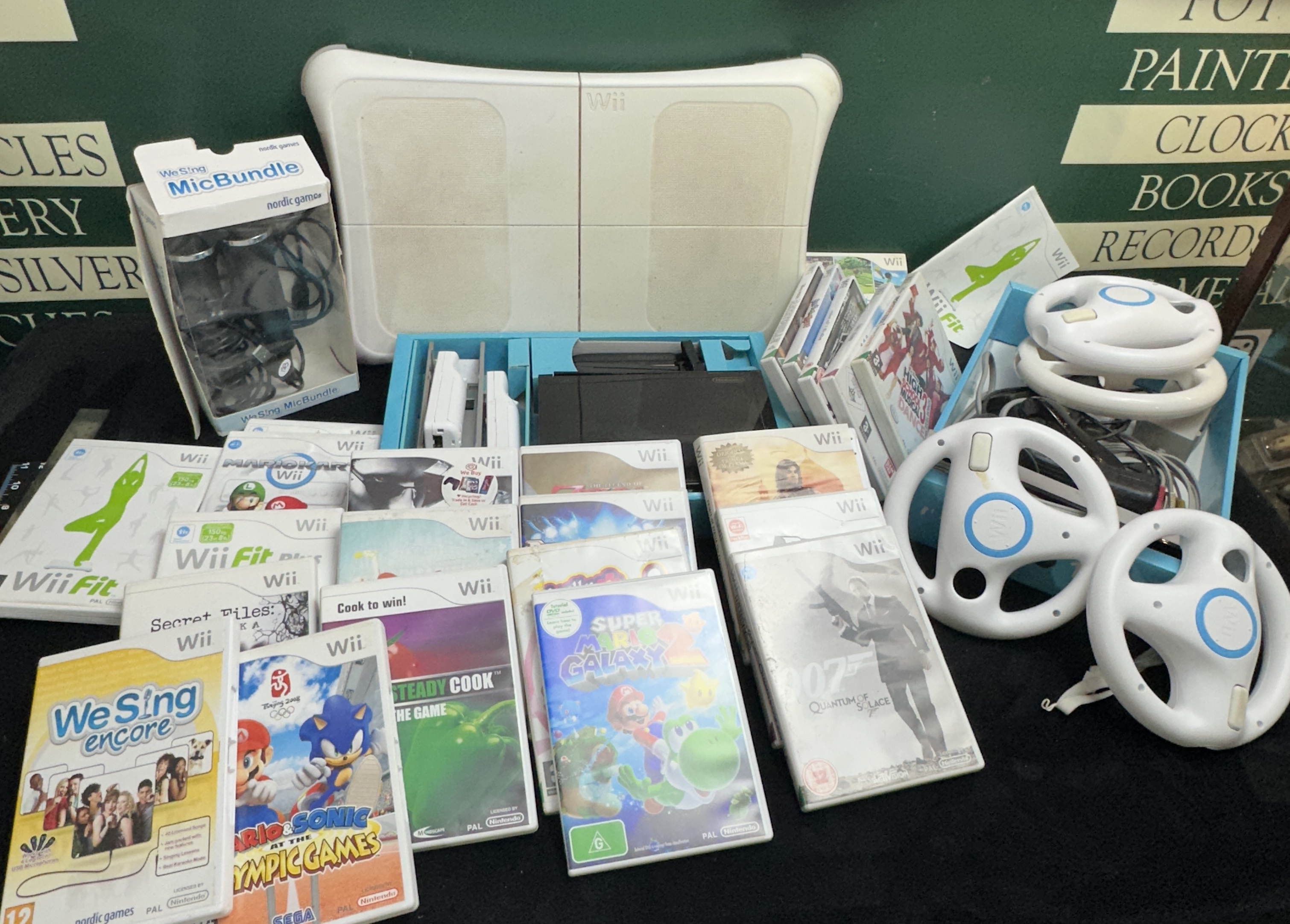 A Nintendo Wii Gaming Collection with Console, Peripherals, and Software