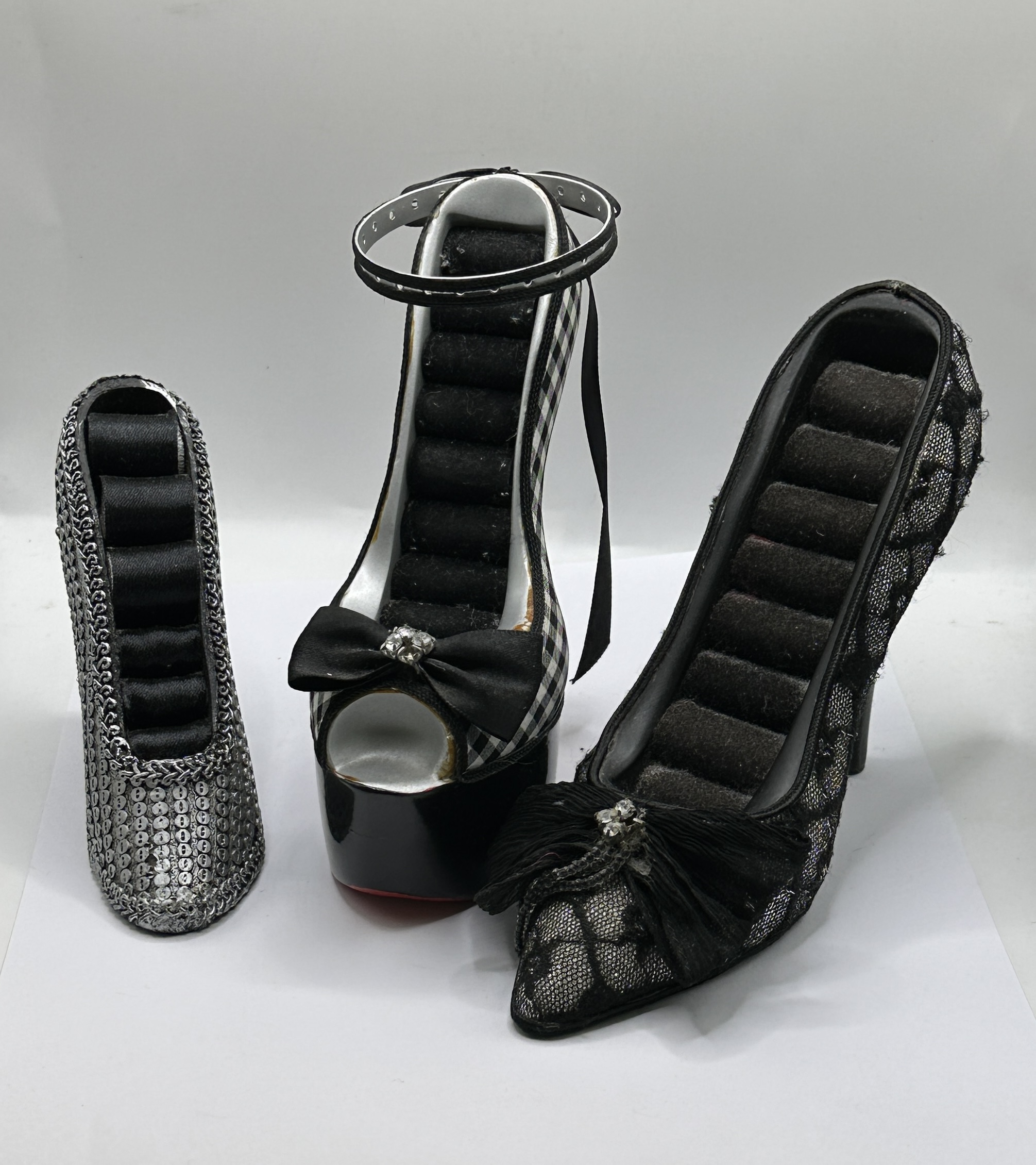 A Trio of Decorative High Heel Shoe Form Ring Displays