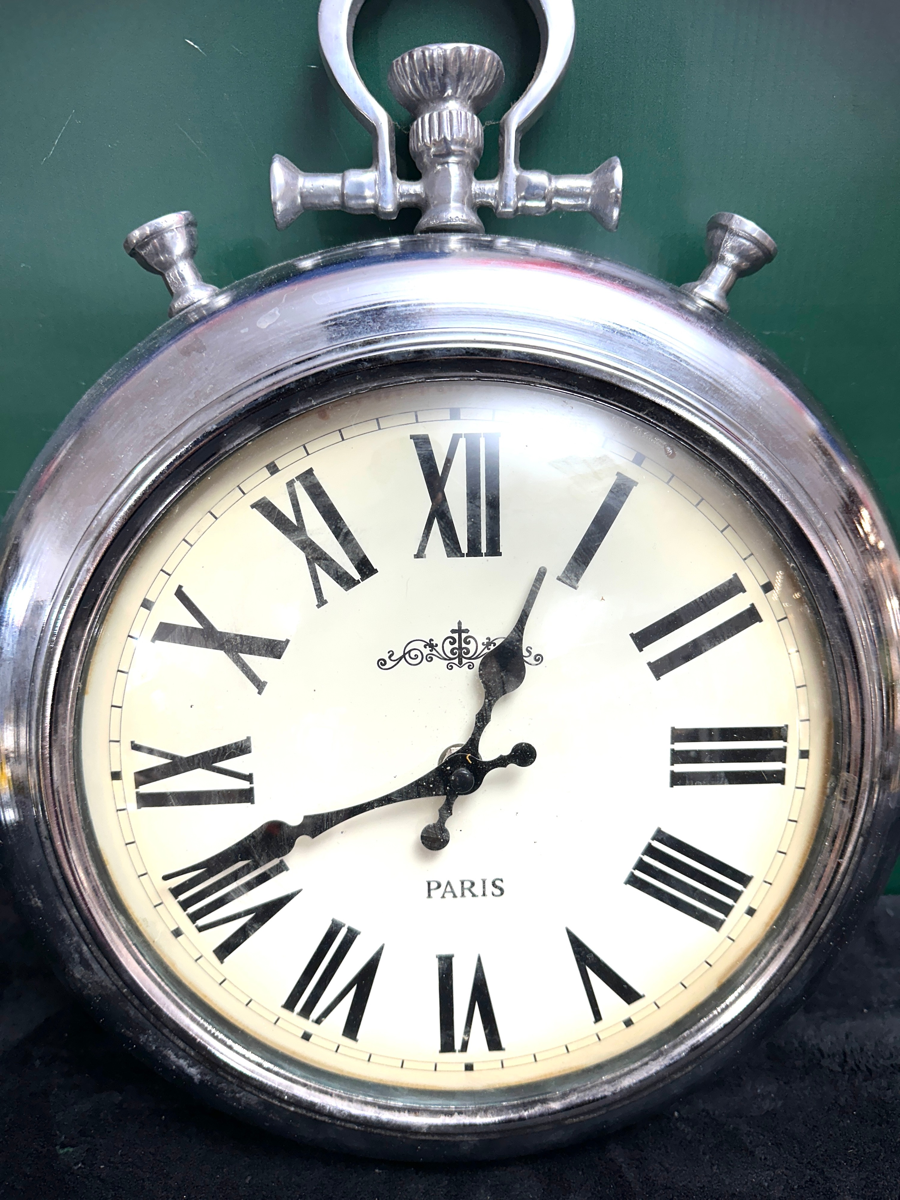 A Metal Wall Clock, Designed as an Oversized Pocket Watch