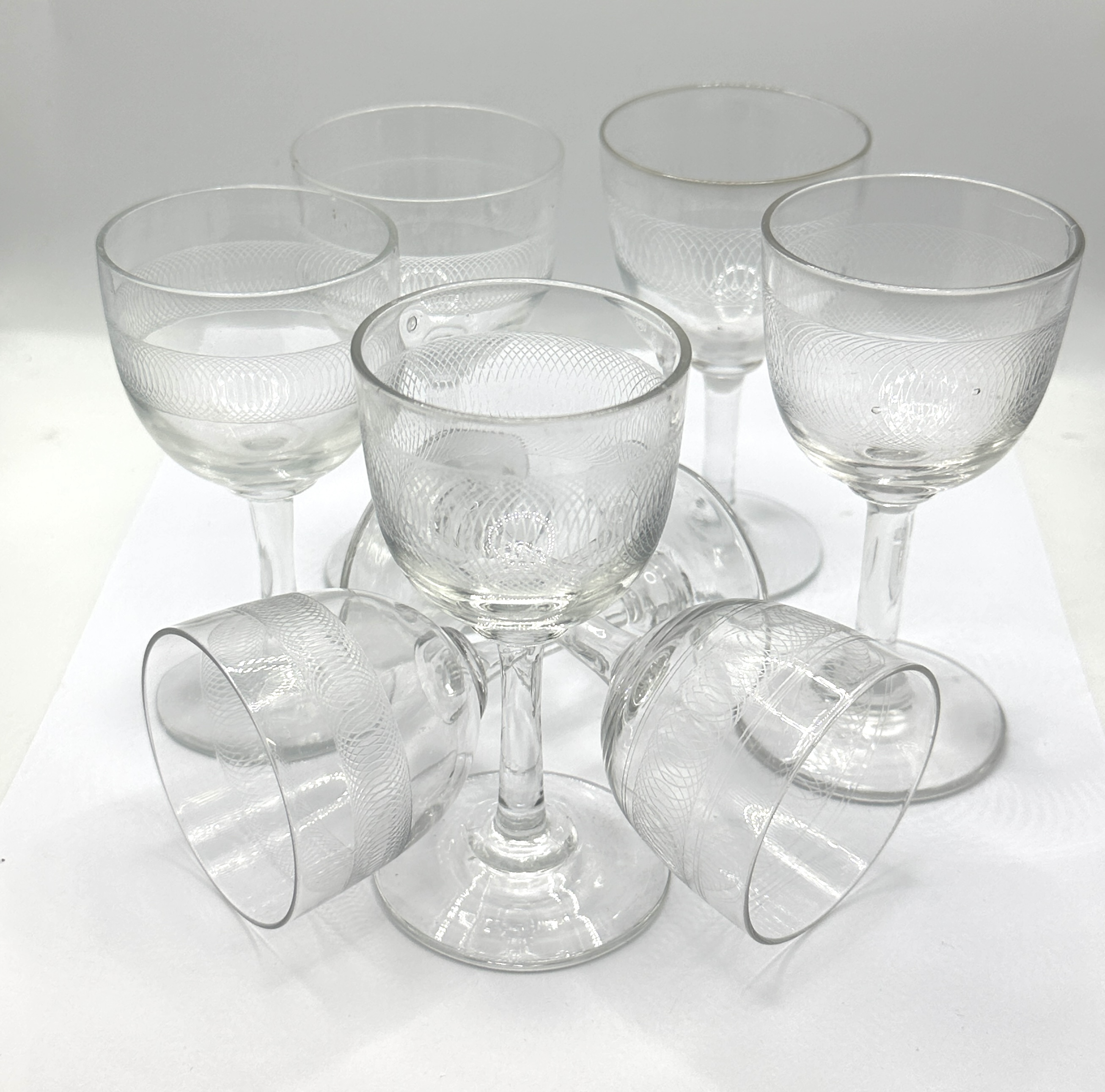 A Set of Seven Vintage Glass Goblets with Etched Border
