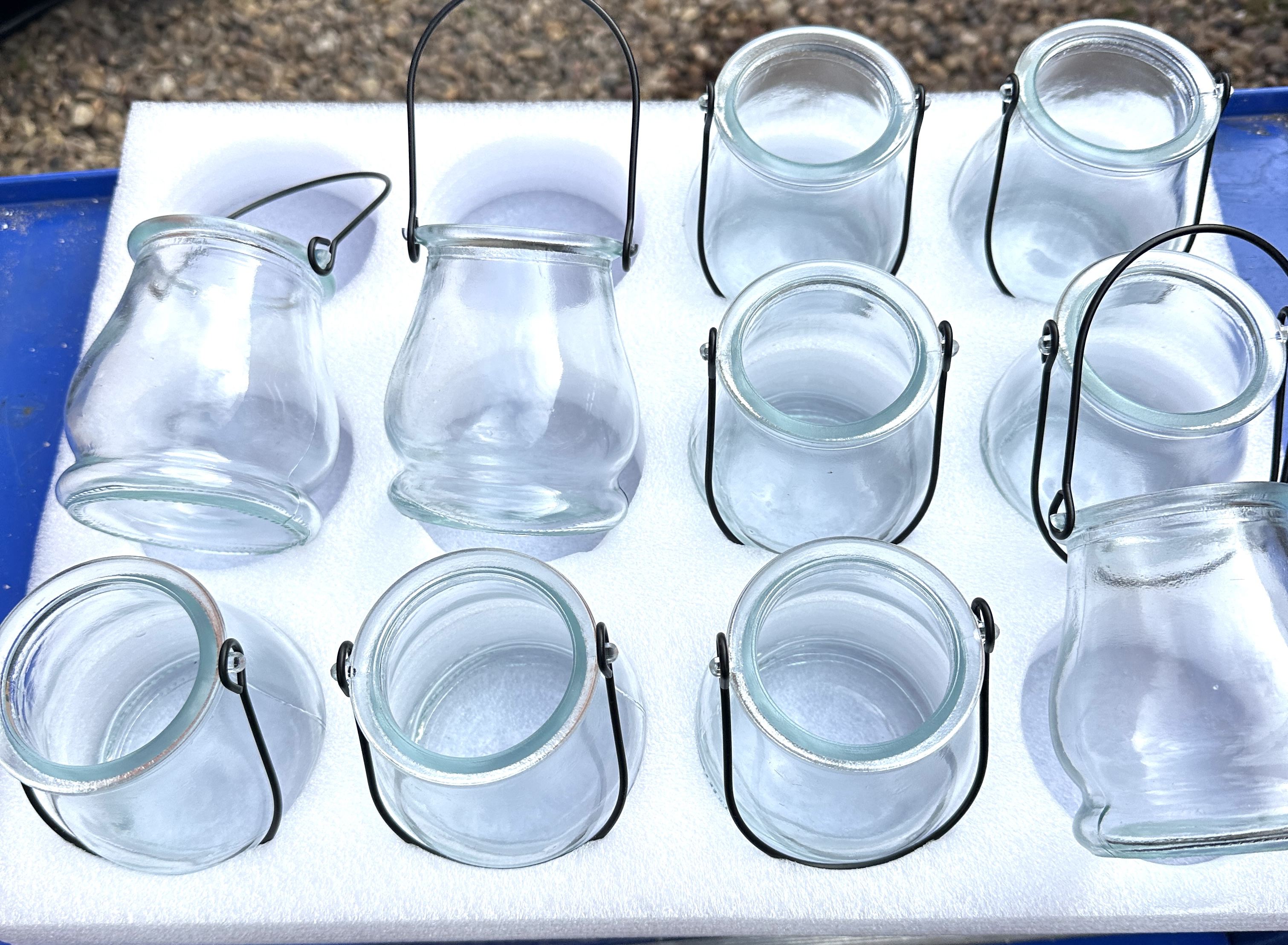 A Set of Twelve Contemporary Clear Glass Hanging Lanterns