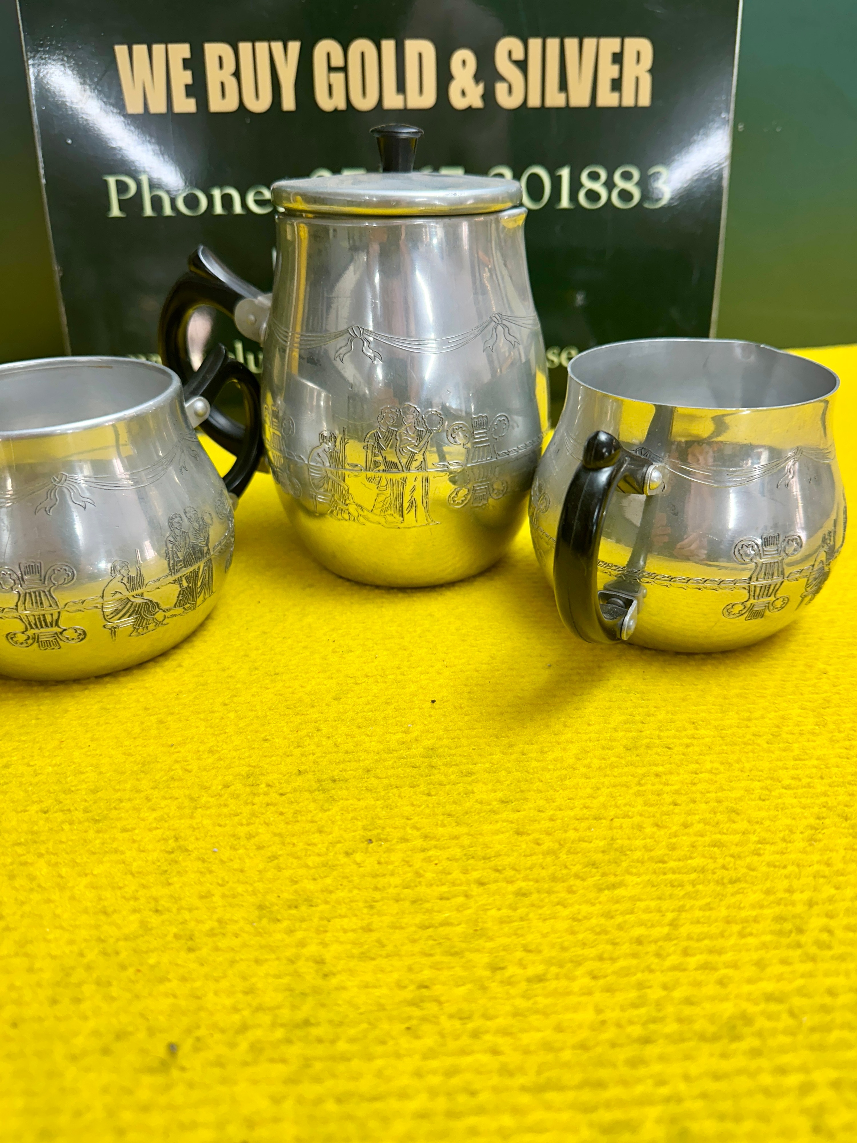 A Trio of Neoclassical Style Metal Beverage Vessels