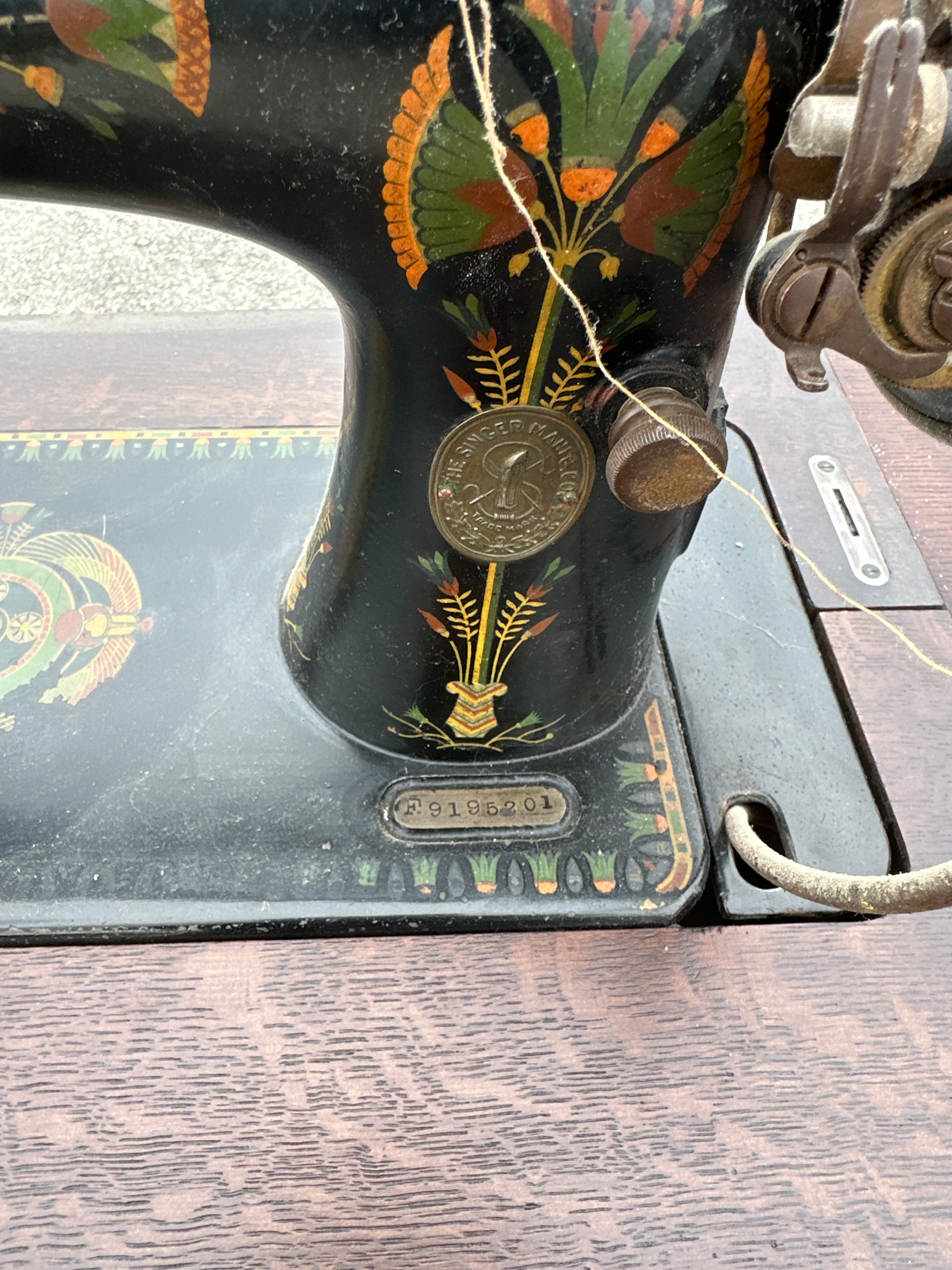 A Singer Model 66K Treadle Sewing Machine with Wooden Cabinet