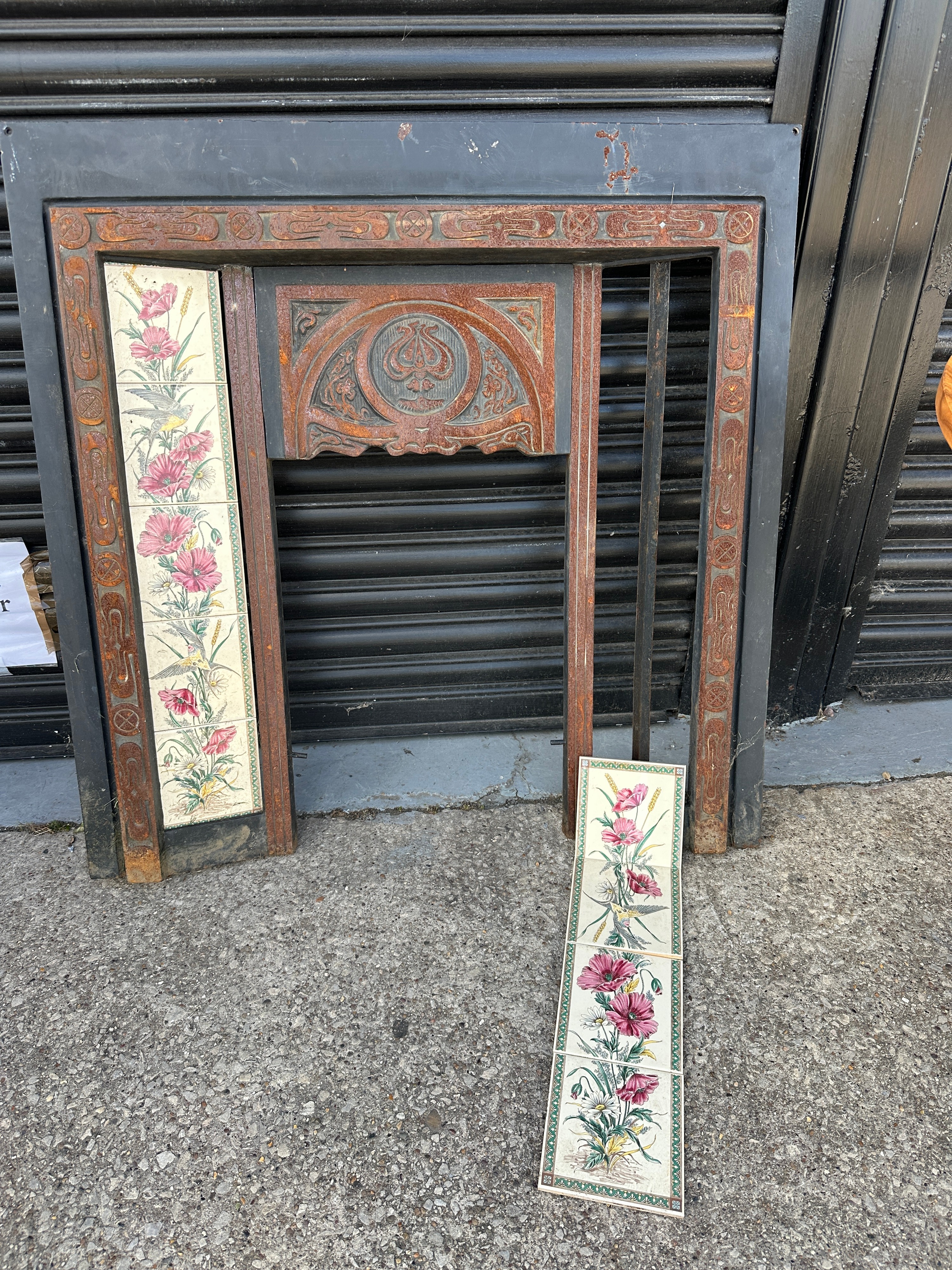 A Late 19th Century Tiled Fireplace Insert With Poppies