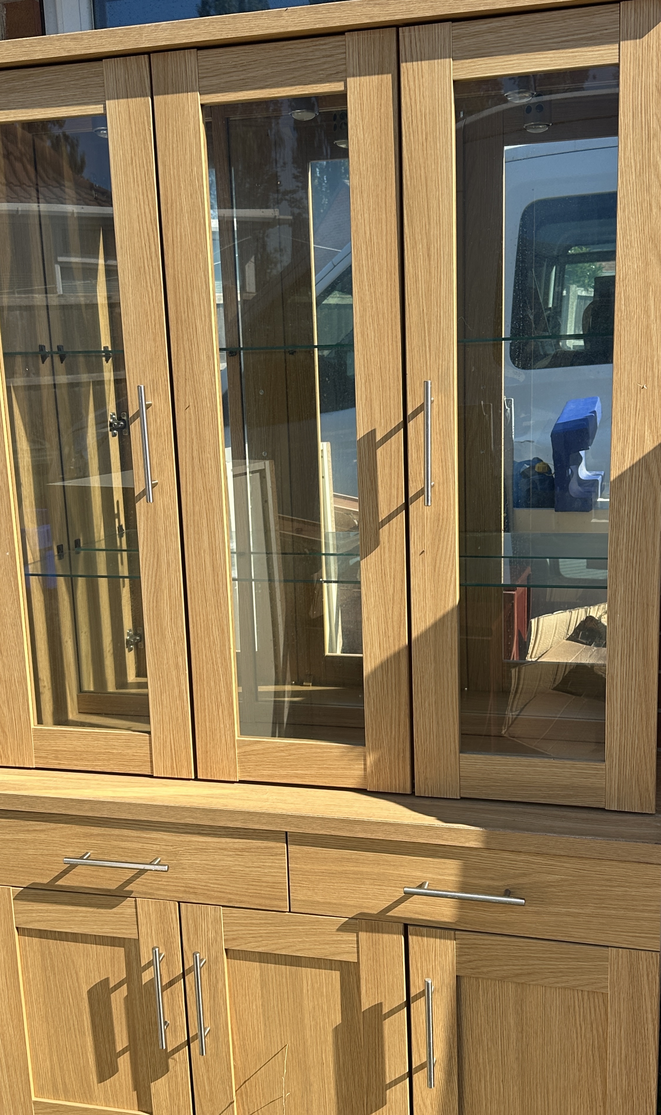 A Contemporary Two Piece Glazed Oak Display Cabinet and Sideboard
