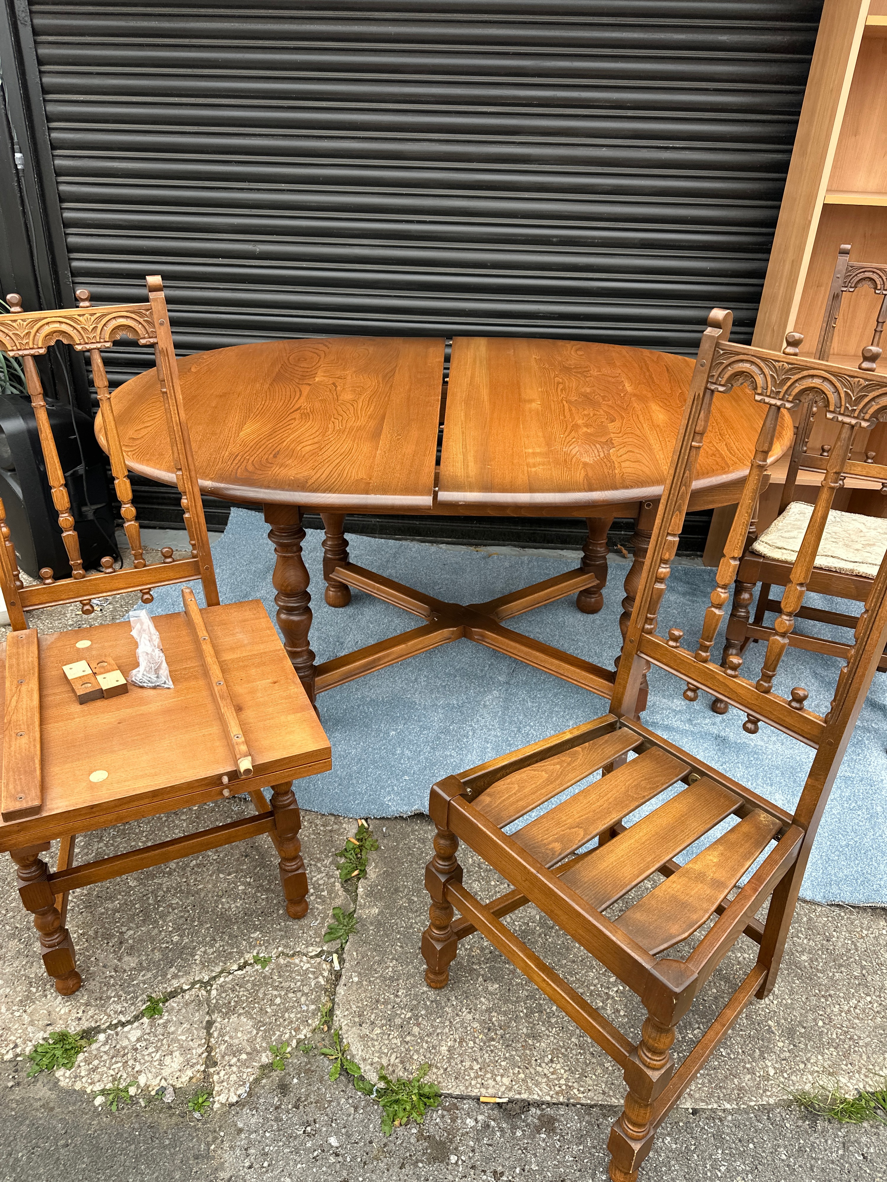 A Hardwood Drop Leaf Dining Table and Several Matching Chairs
