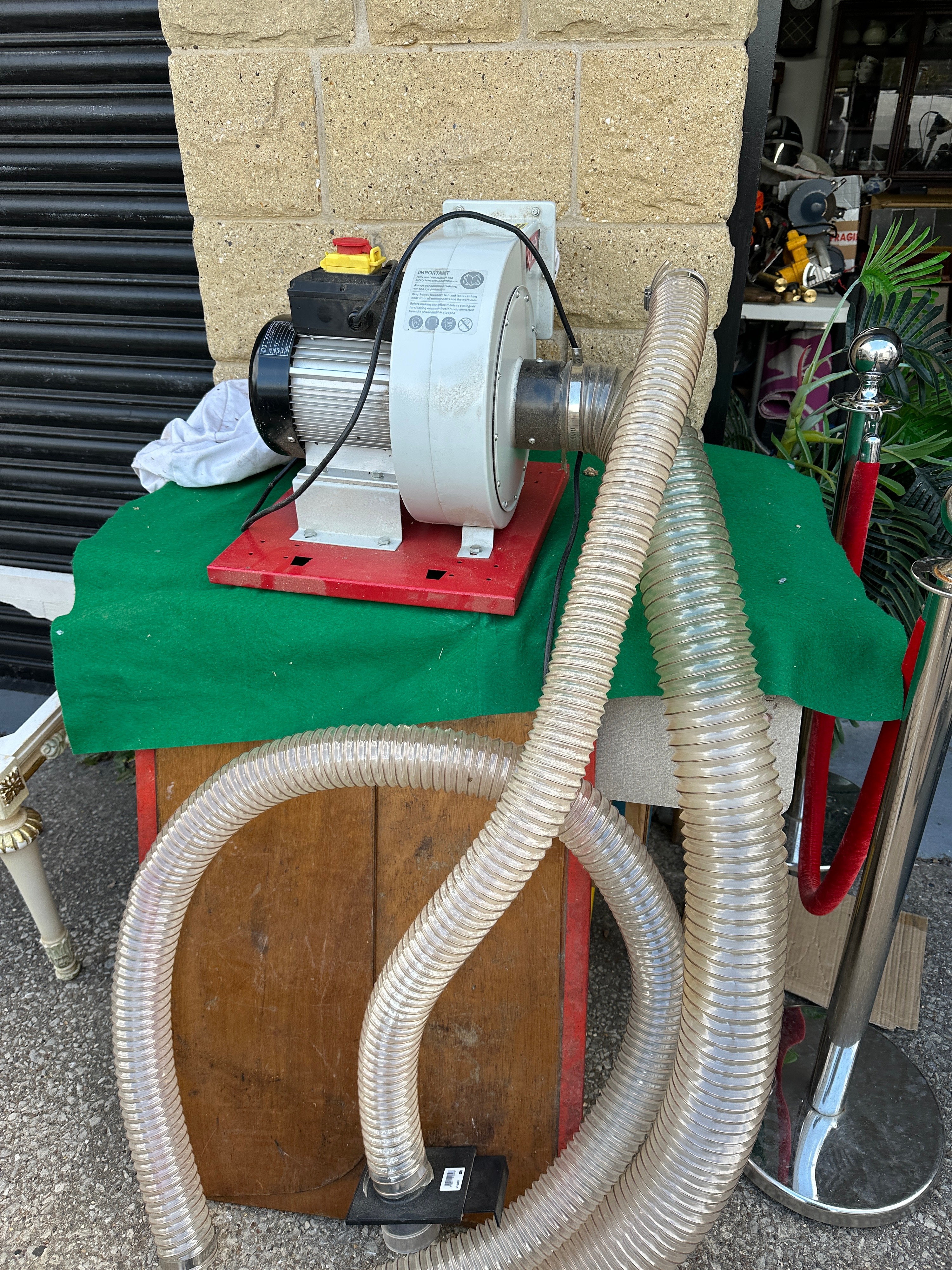 An Axminster Craft AC37E Wall Mounted Dust Extractor with Ducting Accessories