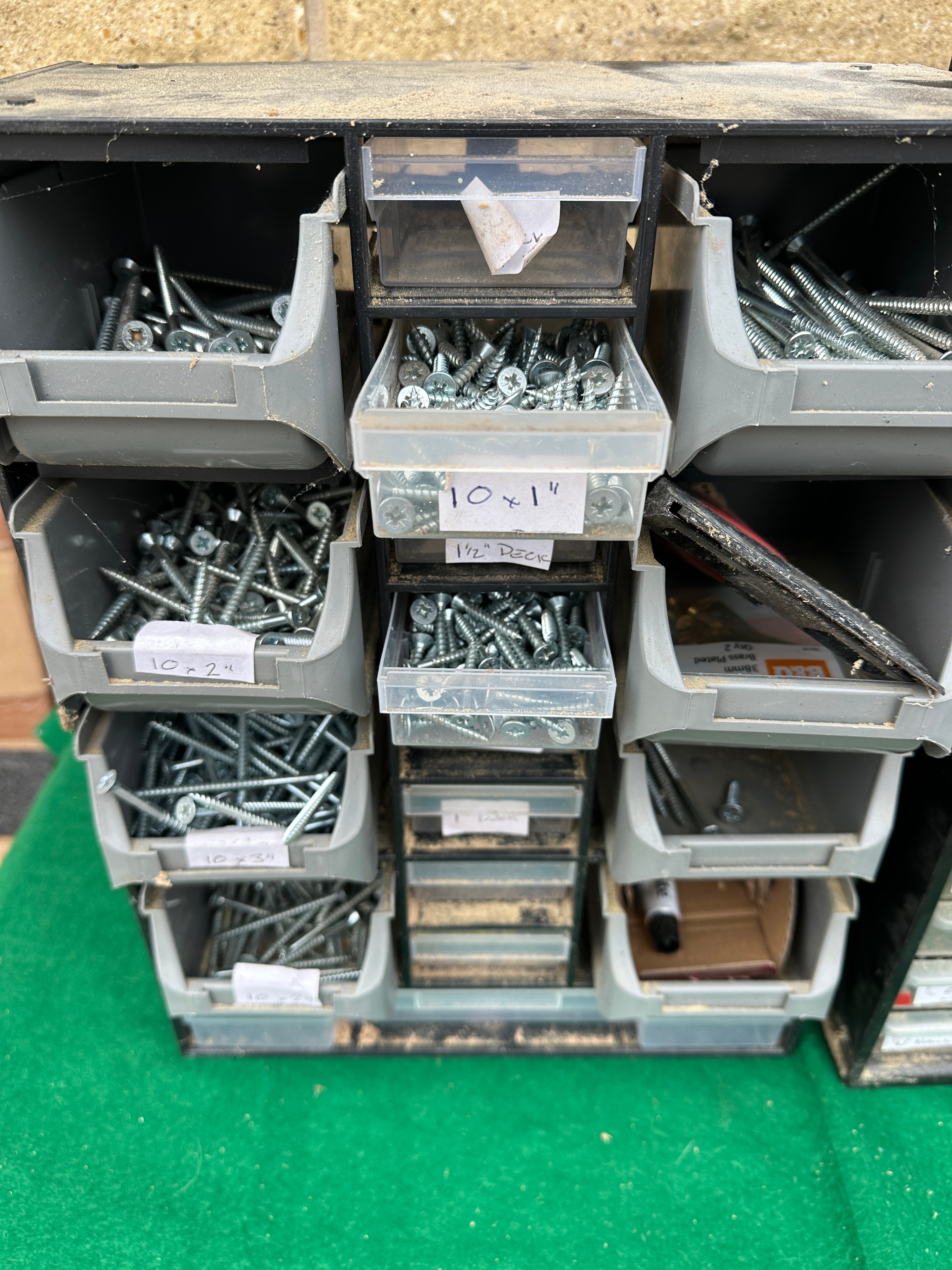 A Collection of Workshop Fasteners in Two Bench-Top Storage Units