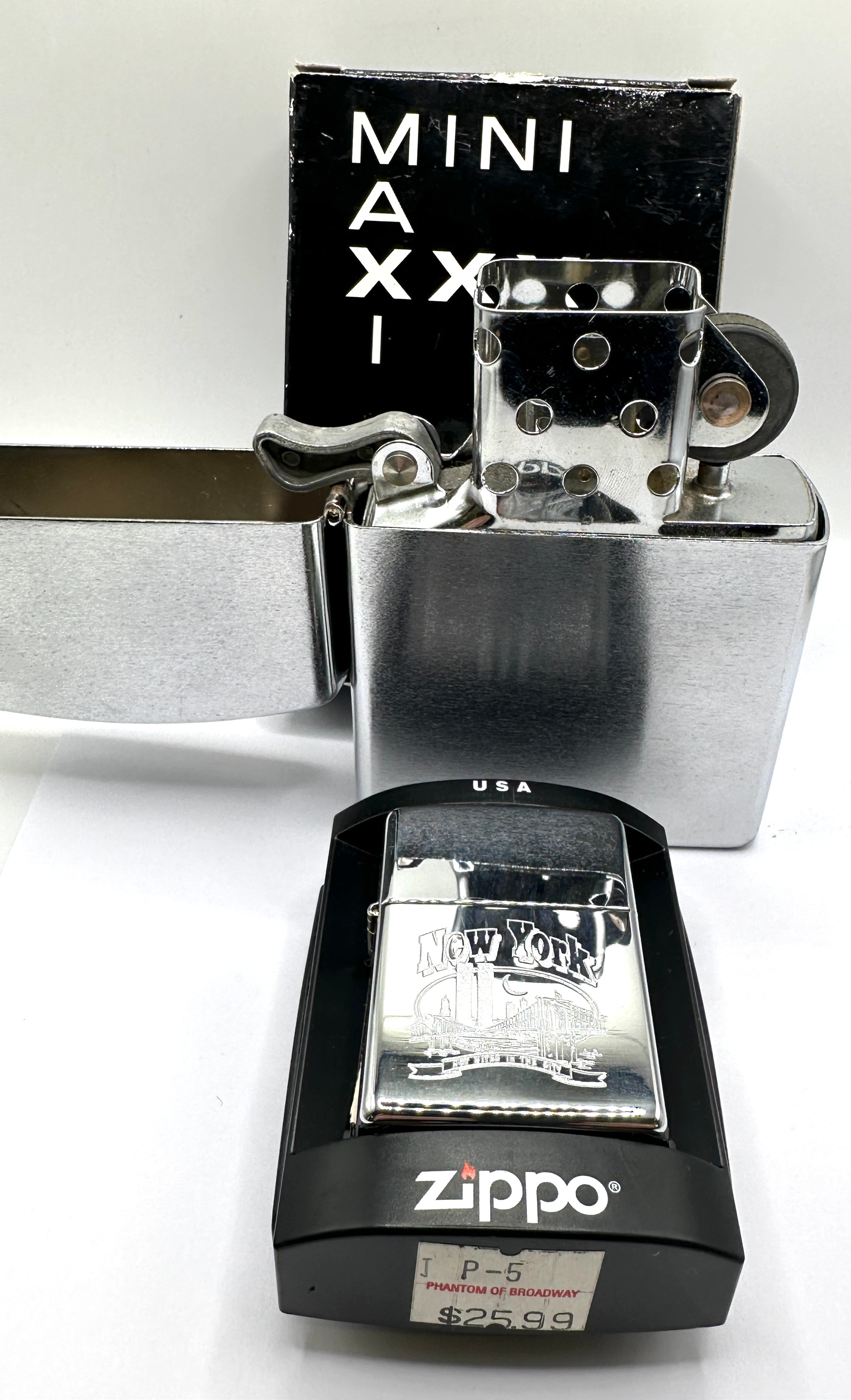 A Zippo New York City Pocket Lighter and Maxi Novelty Table Lighter
