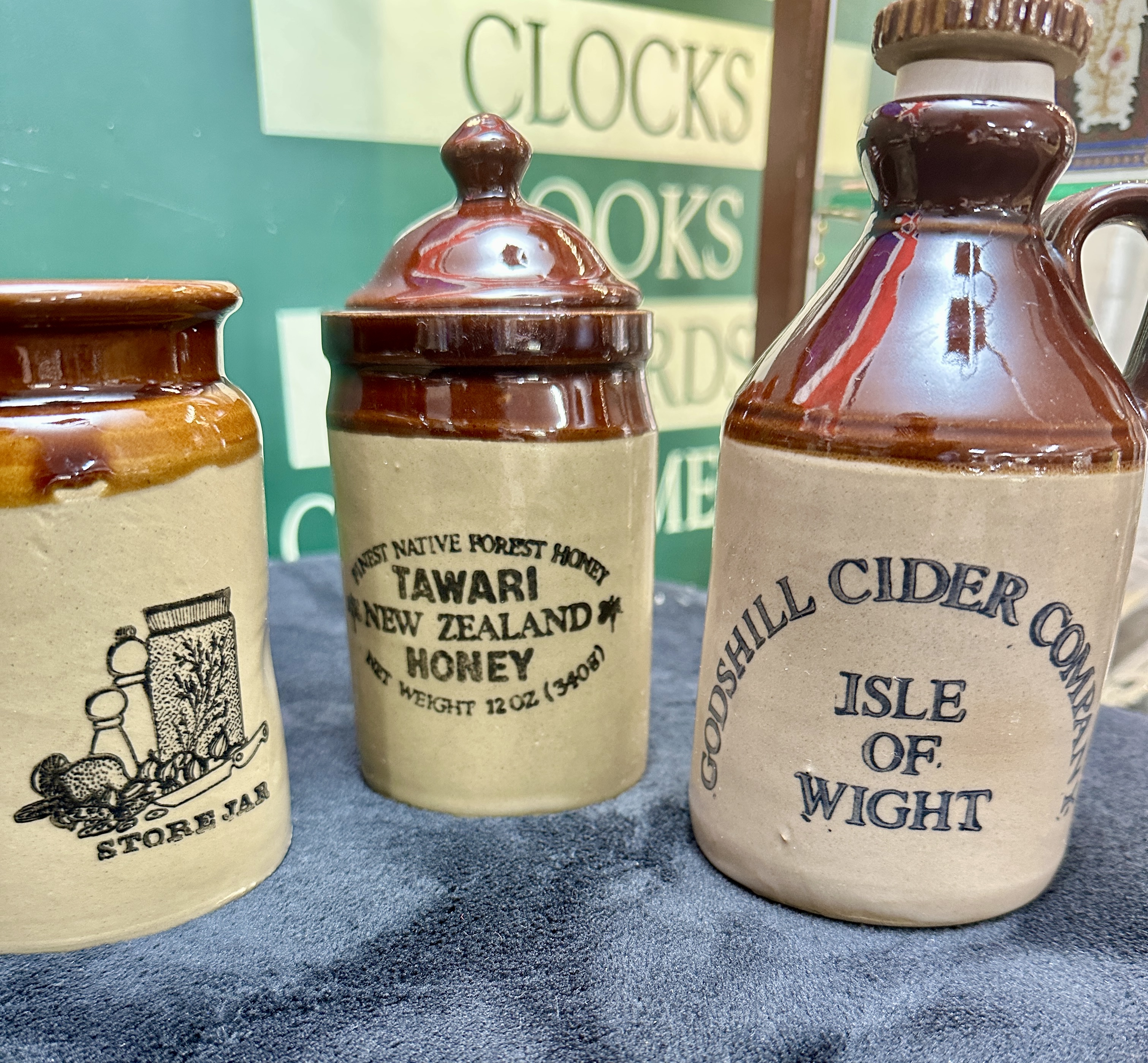 A Trio of Stoneware Containers including Godshill Cider Company Jug