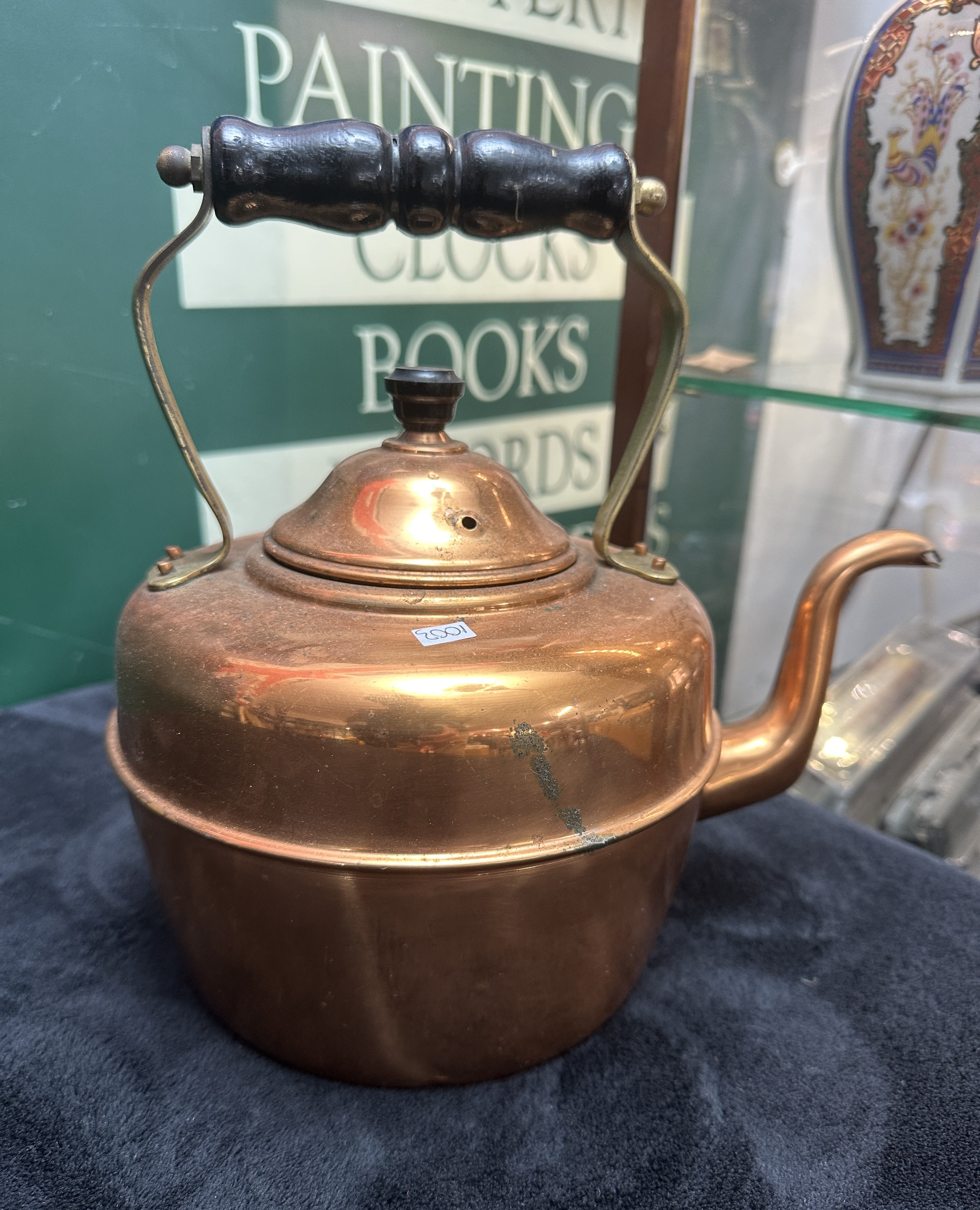 A Traditional Polished Copper Tea Kettle