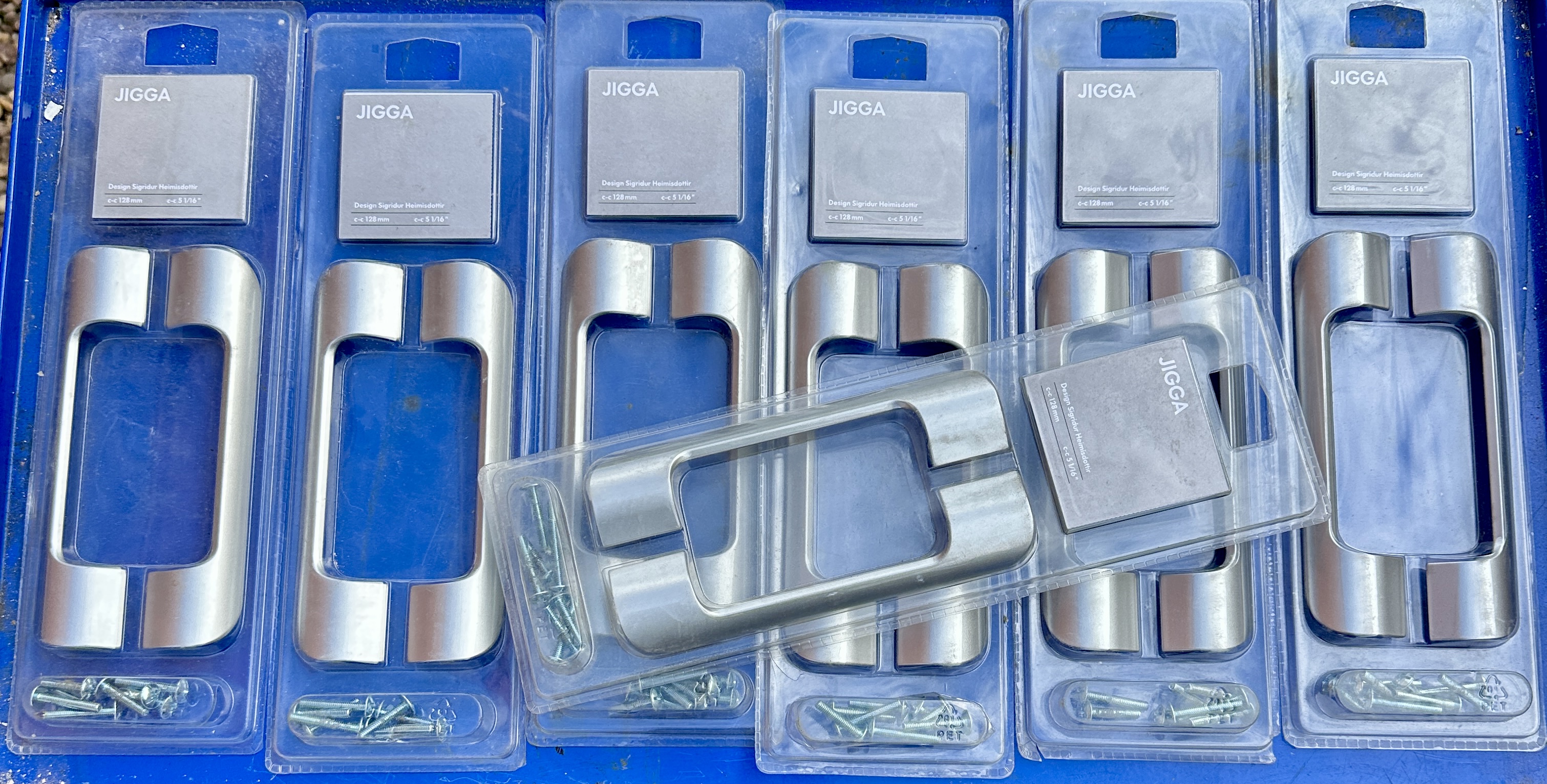 A Set of Seven JIGGA Cabinet Pull Handles