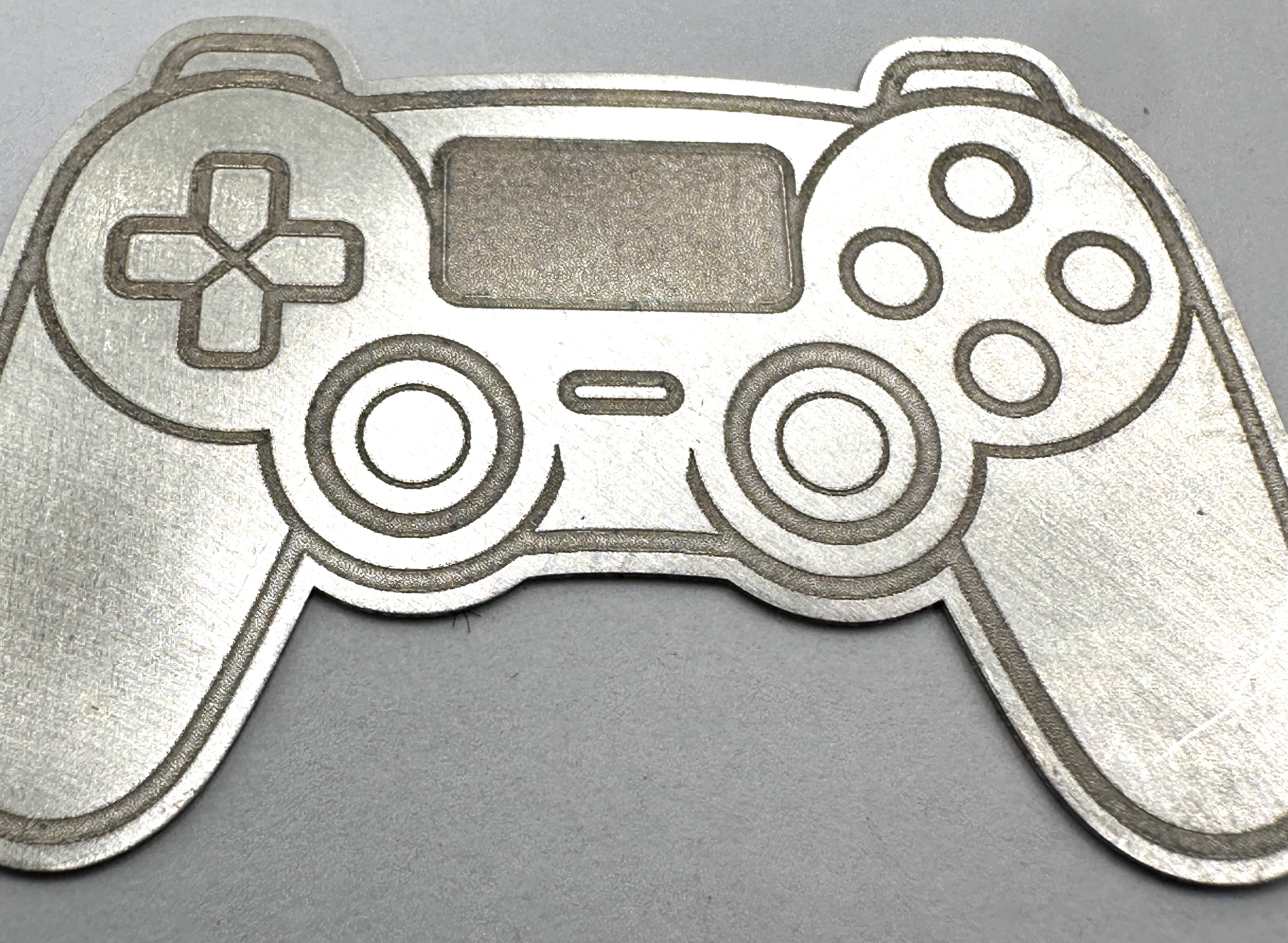 A 999 Fine Silver Bullion Gaming Controller Round From One of Scotlands Finest "PURE"