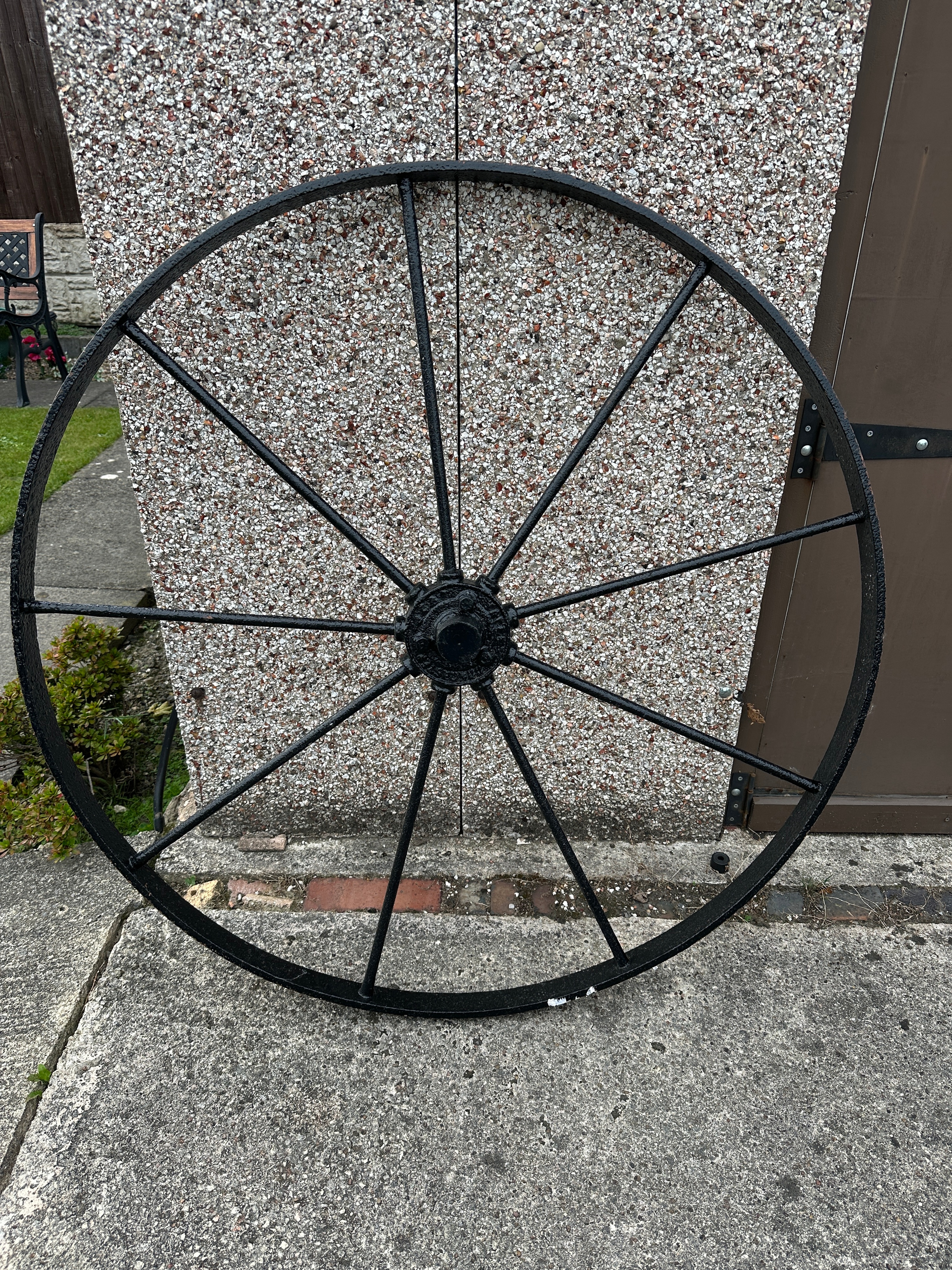A Large Ten-Spoke Metal Agricultural Wheel