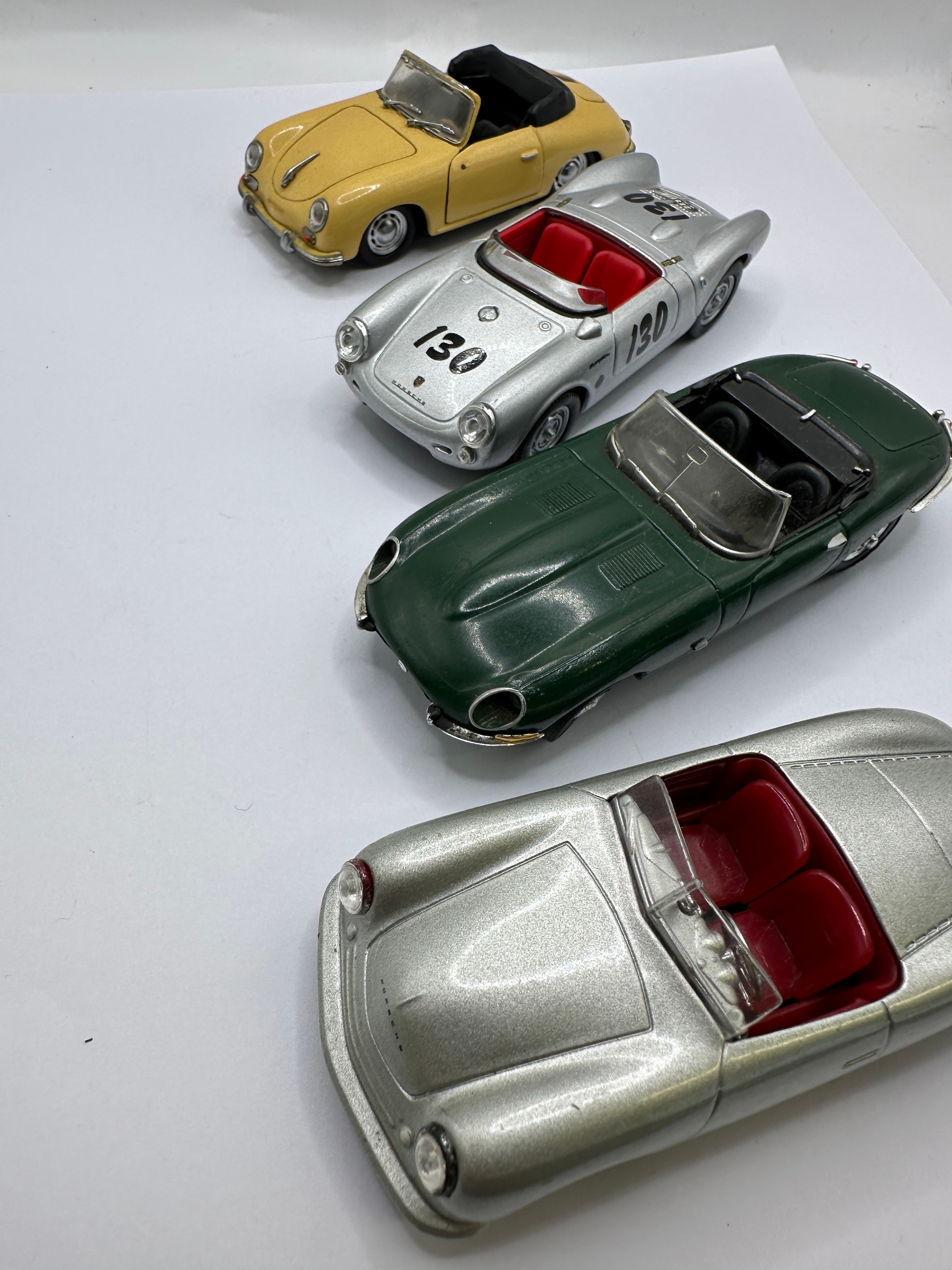 A Group of Four Porsche and Jaguar Scale Model Vehicles