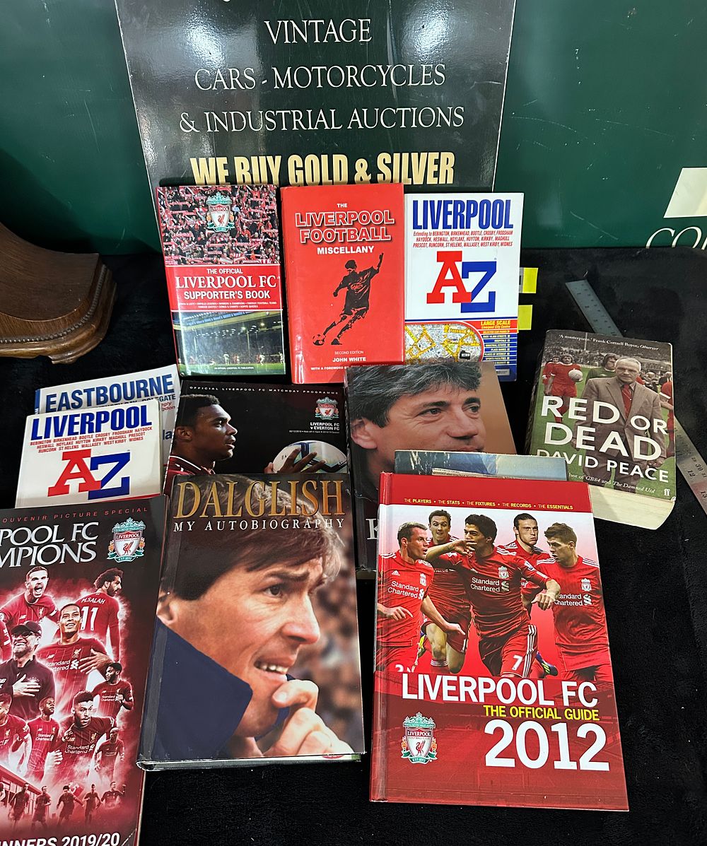 Lot 408: A Collection of Liverpool Football Club Books and Advertising Sign