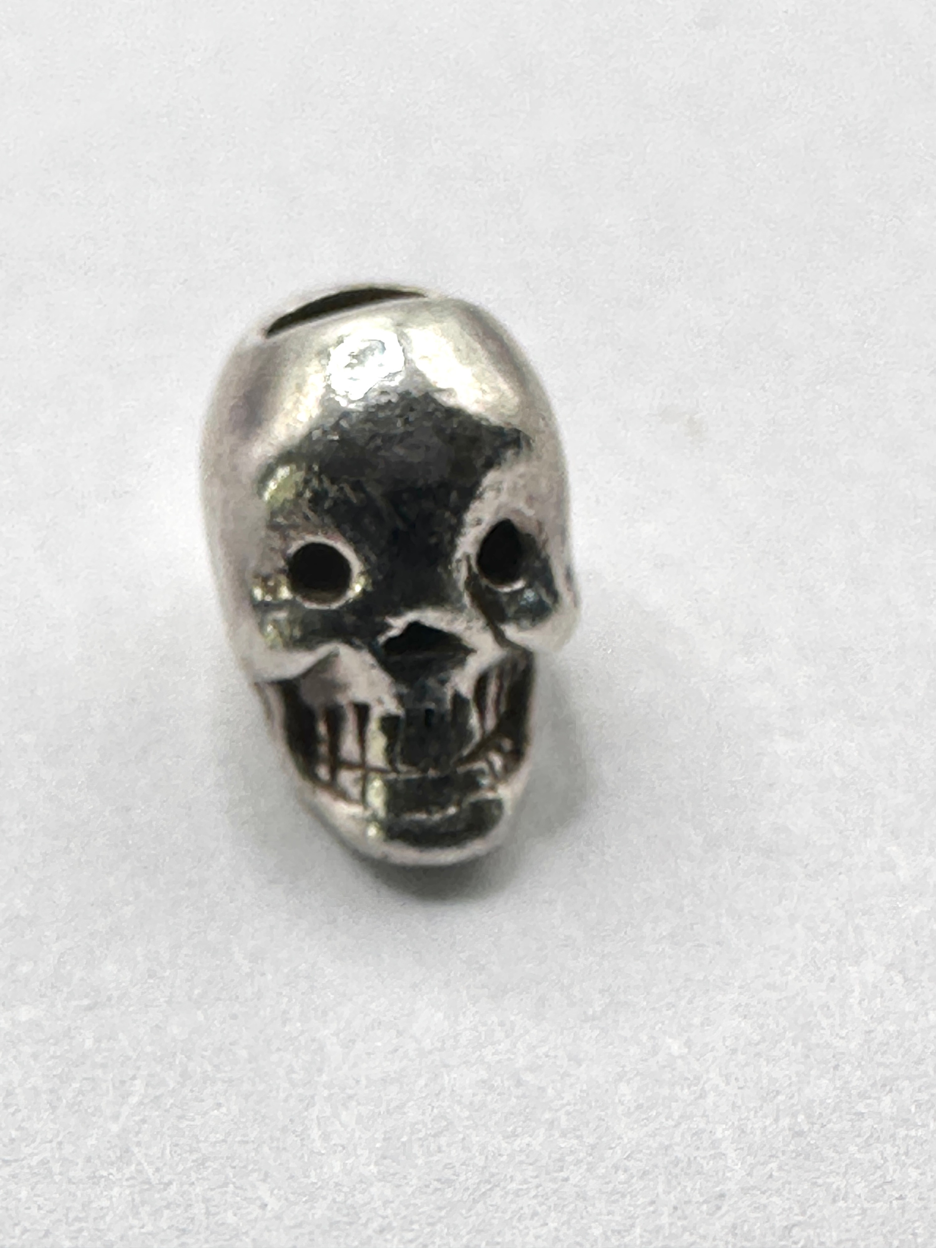 A Stylised Human Skull Bead