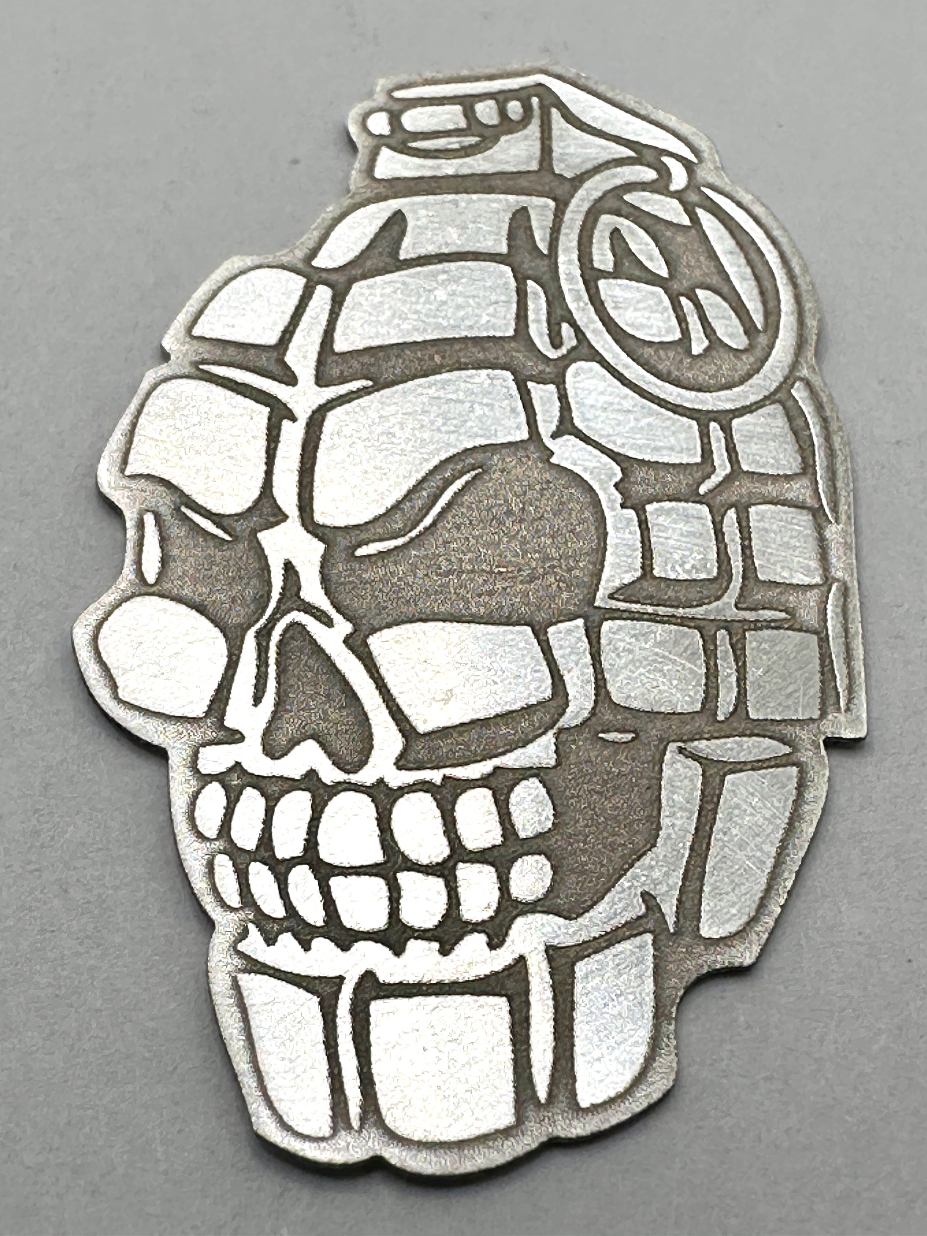 A 999 Fine Silver Bullion Piece, Grenade Skull Design