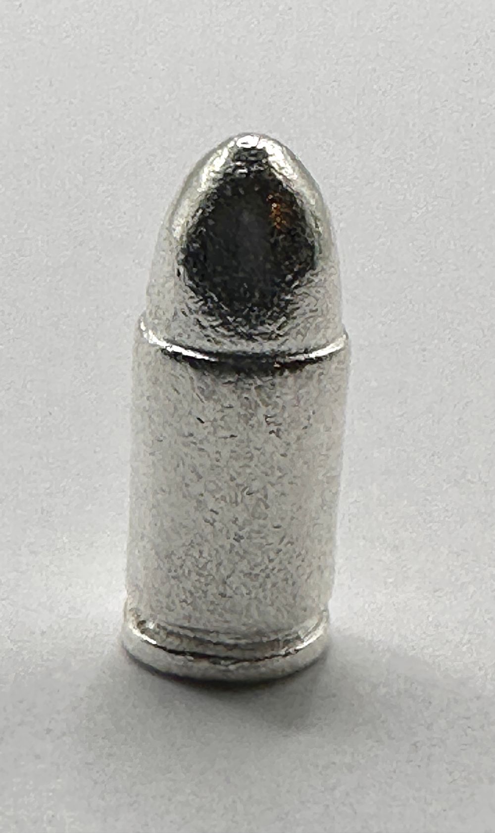 Lot 438: A Cast .999 Fine Silver 9mm Cartridge Bullion Piece