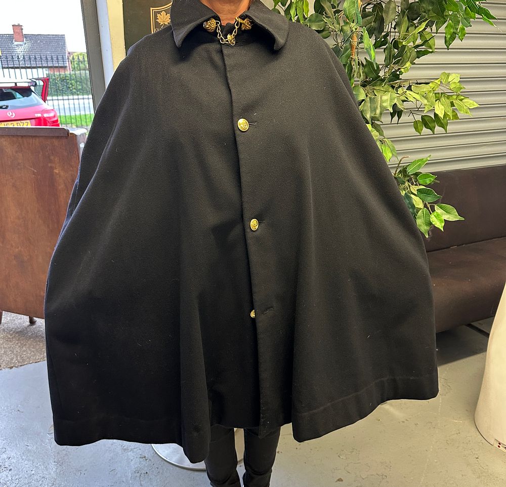 Lot 508: A Full-Length Heavy Black Wool Cape With Lion Head Clasp