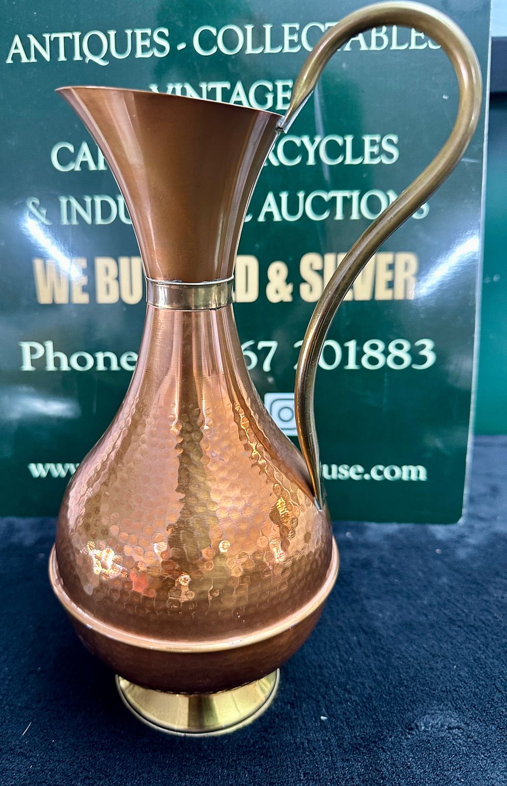 Lot 519: A Mid-20th Century Metal Ewer with Hand-Hammered Decoration