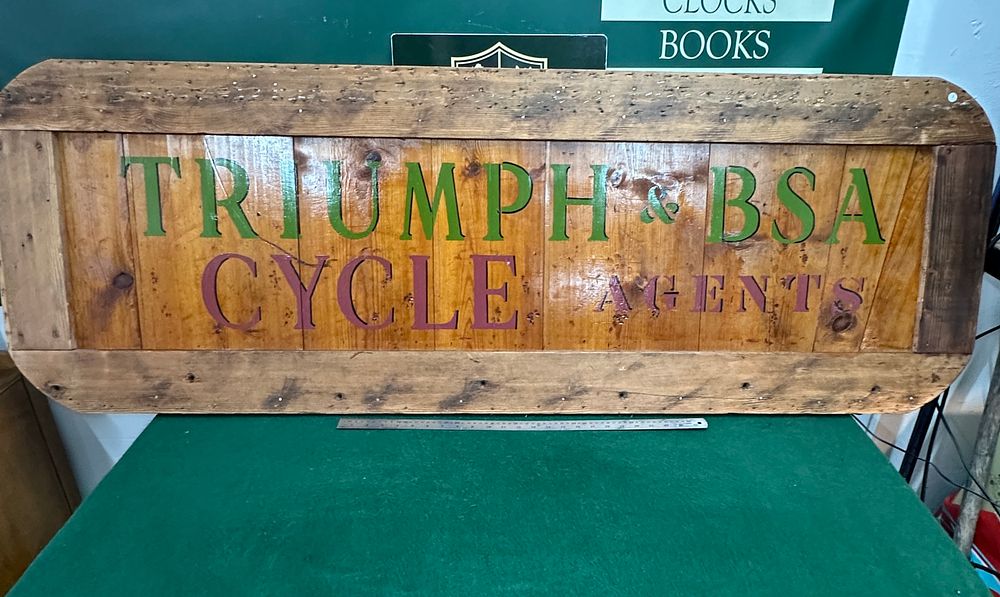 Lot 522: A Large Hand-Painted Wooden Triumph and BSA Cycle Agents Shop Sign
