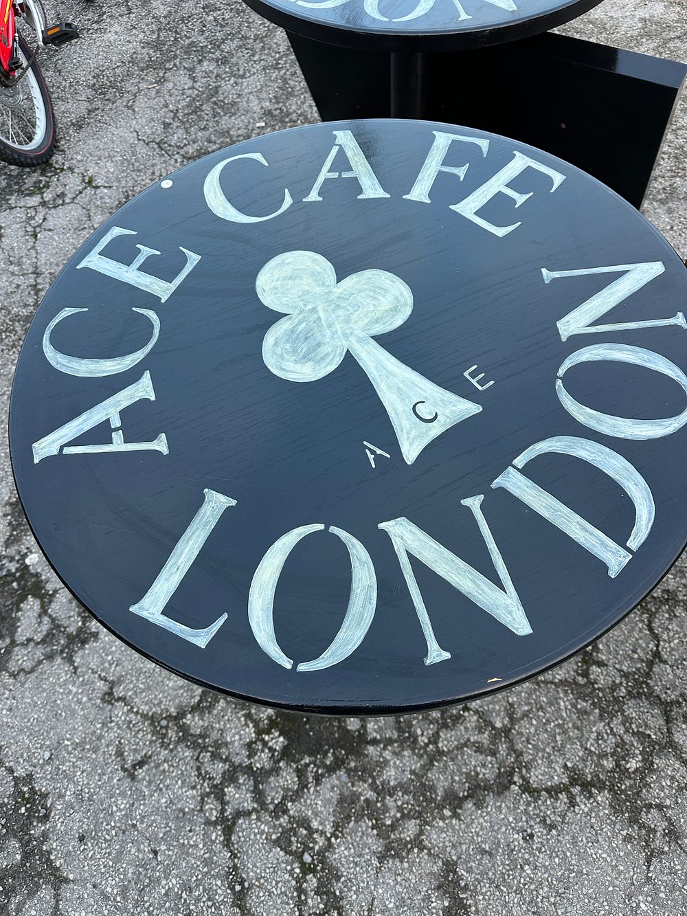 Lot 534: Multiple Ace Cafe London Pedestal Tables