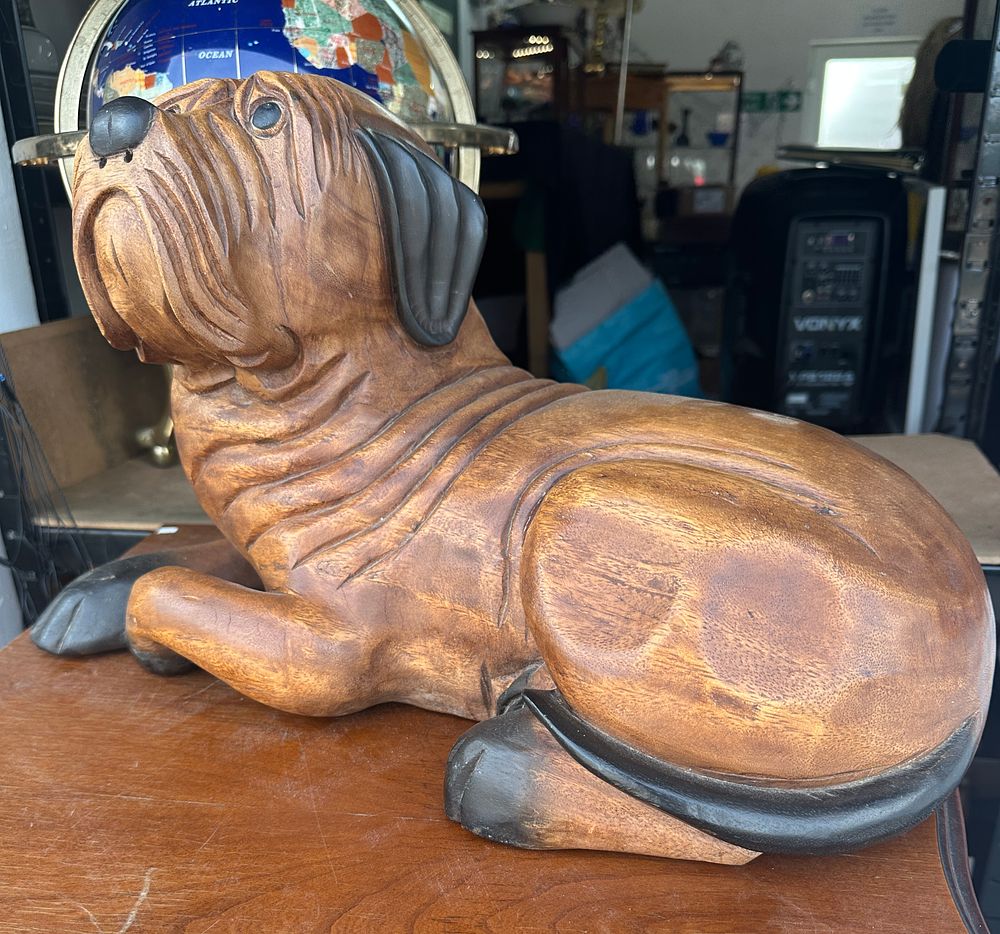 Lot 535: A Hand-Carved Hardwood Sculpture of a Recumbent Mastiff