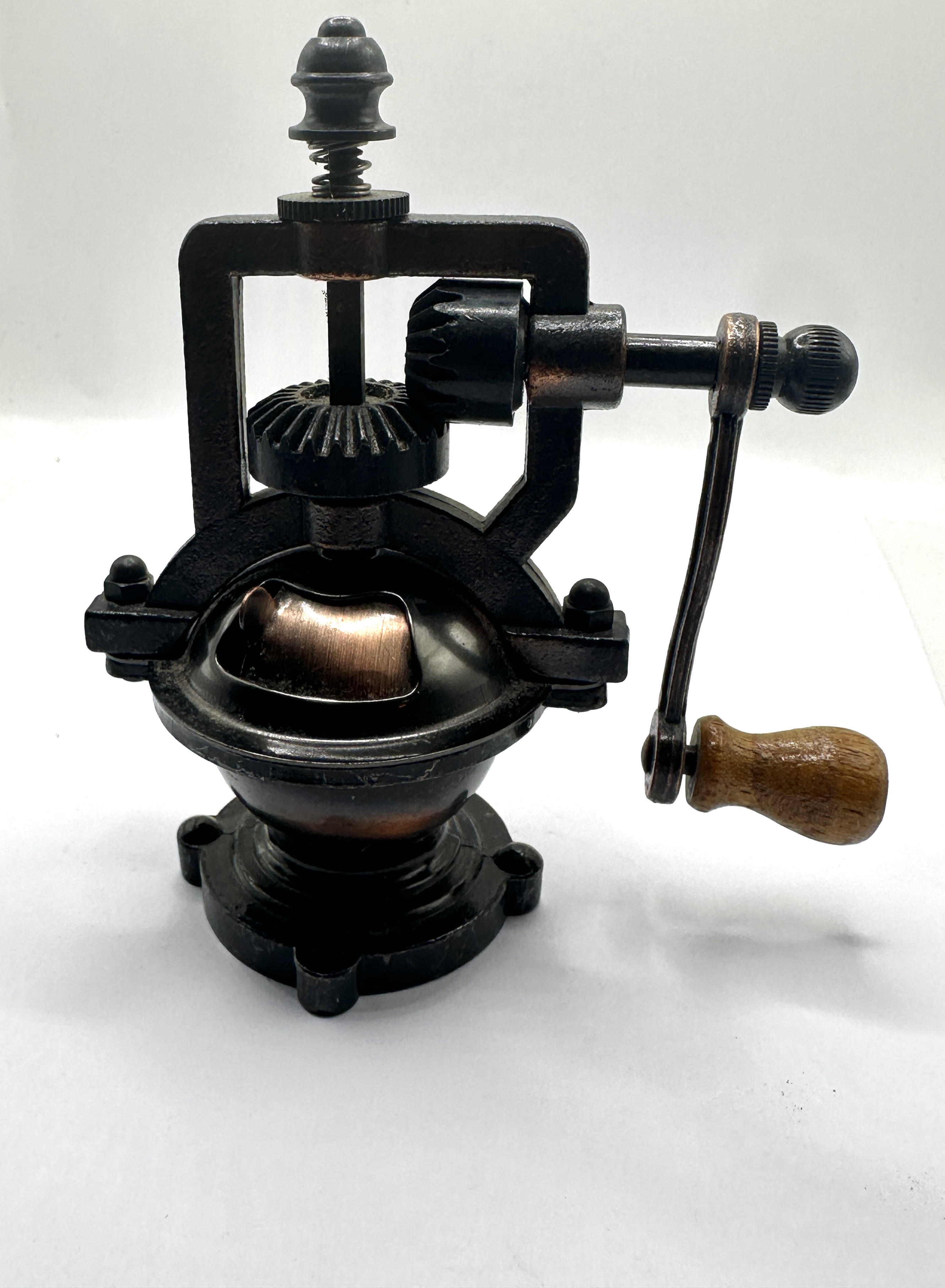 A Metal Countertop Grinder With A Bevel Gear Mechanism