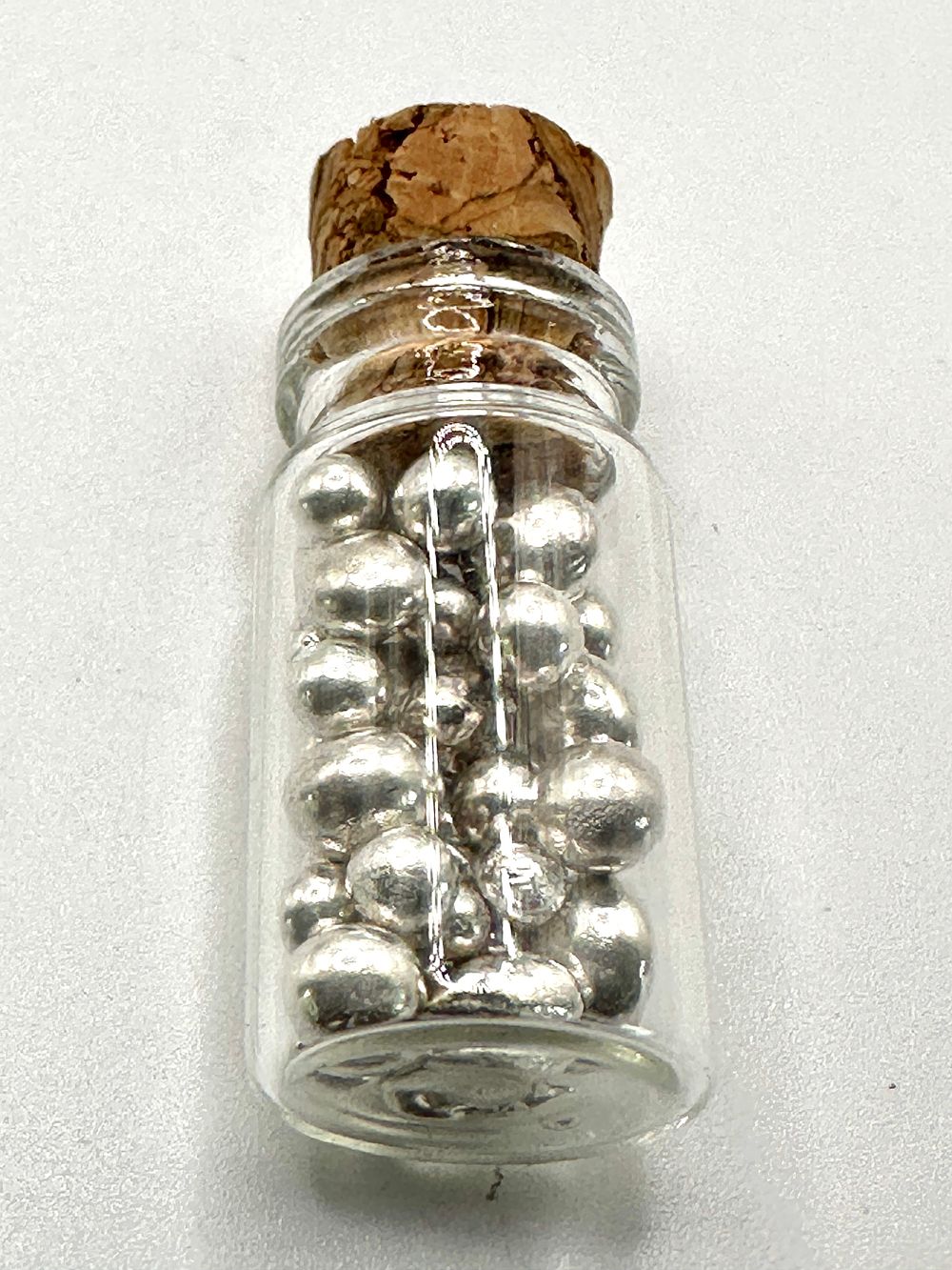 Lot 446: Five Grams Of Fine Silver Grain In A Glass Vial