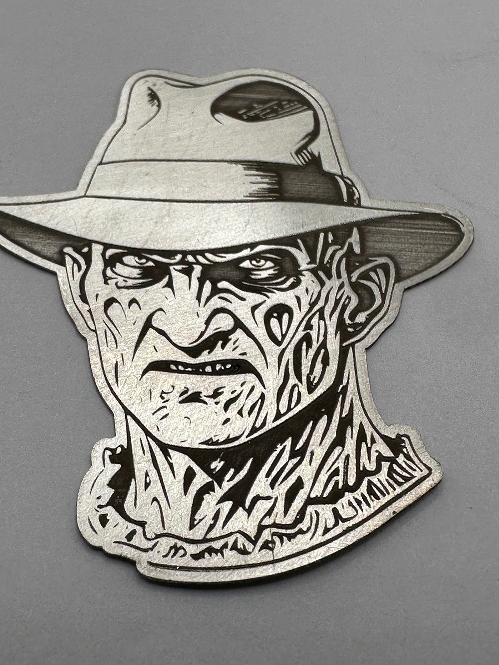 Lot 173: A 999 Fine Silver Nightmare On Elm Street Freddy Krueger Medallion