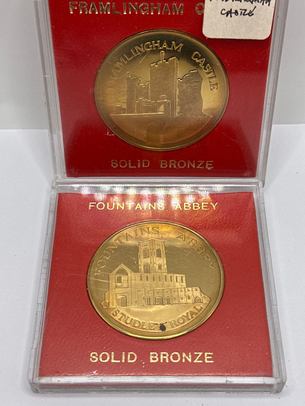 Lot 206: A Pair of UK Solid Bronze Commemorative Medallions, Framlingham Castle and Fountains Abbey