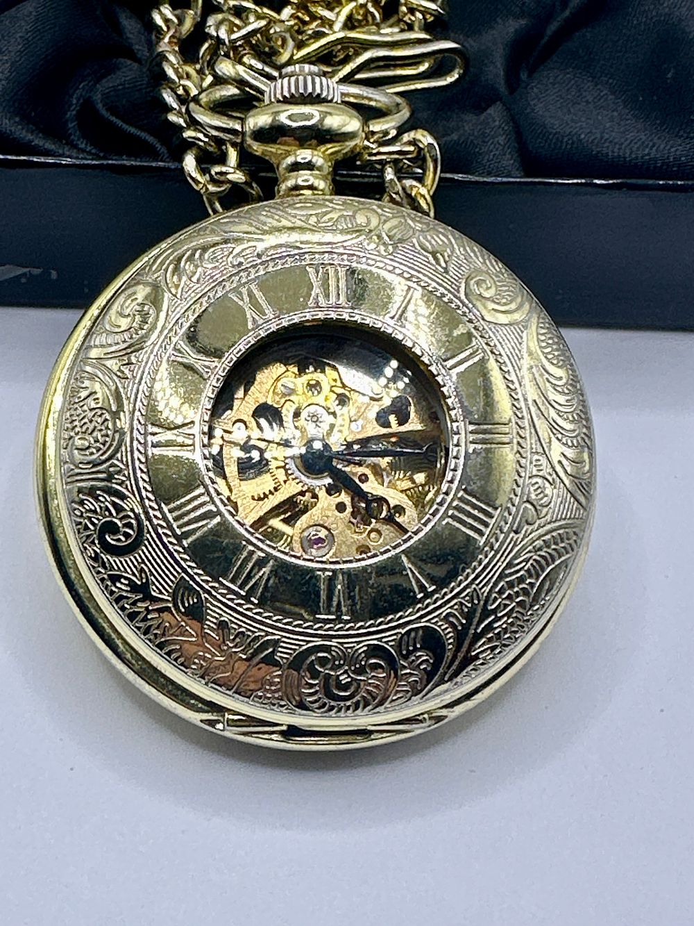 Lot 42: A Boxx Skeletonized Pocket Watch and a Reflex Full Hunter Pocket Watch