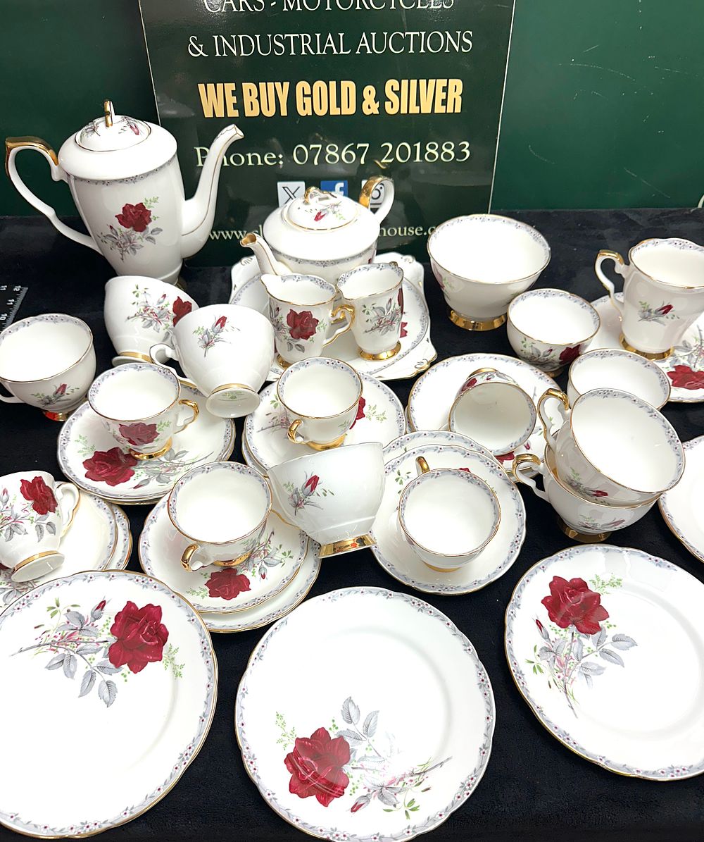 Lot 50: A Royal Stafford Roses To Remember Pattern Bone China Tea and Coffee Service