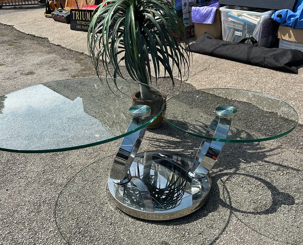 Lot 60: A Contemporary Swivelling Two-Tiered Coffee Table, Polished Chrome and Glass